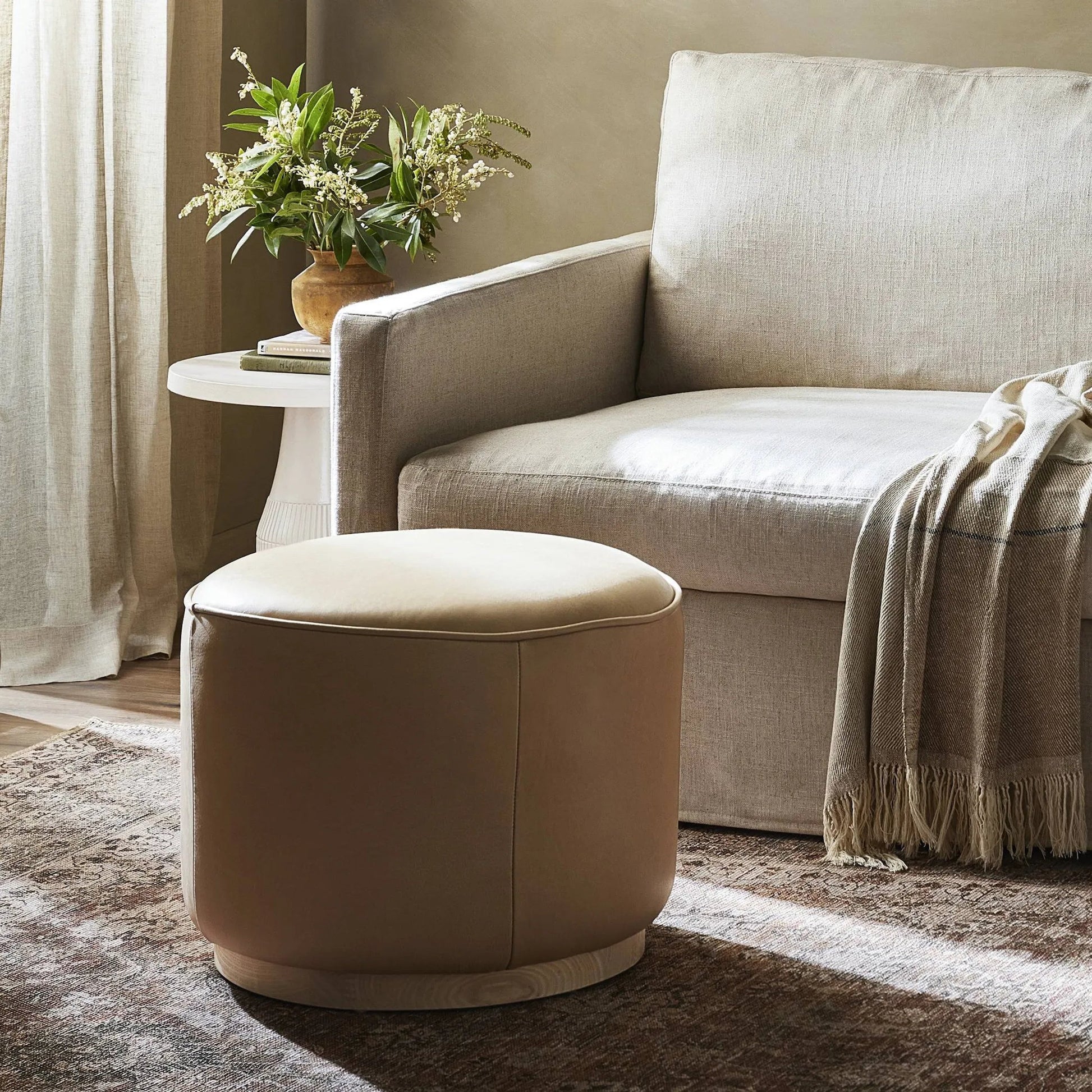 Sinclair Round Ottoman by Four Hands. Made from unique in a modern style.