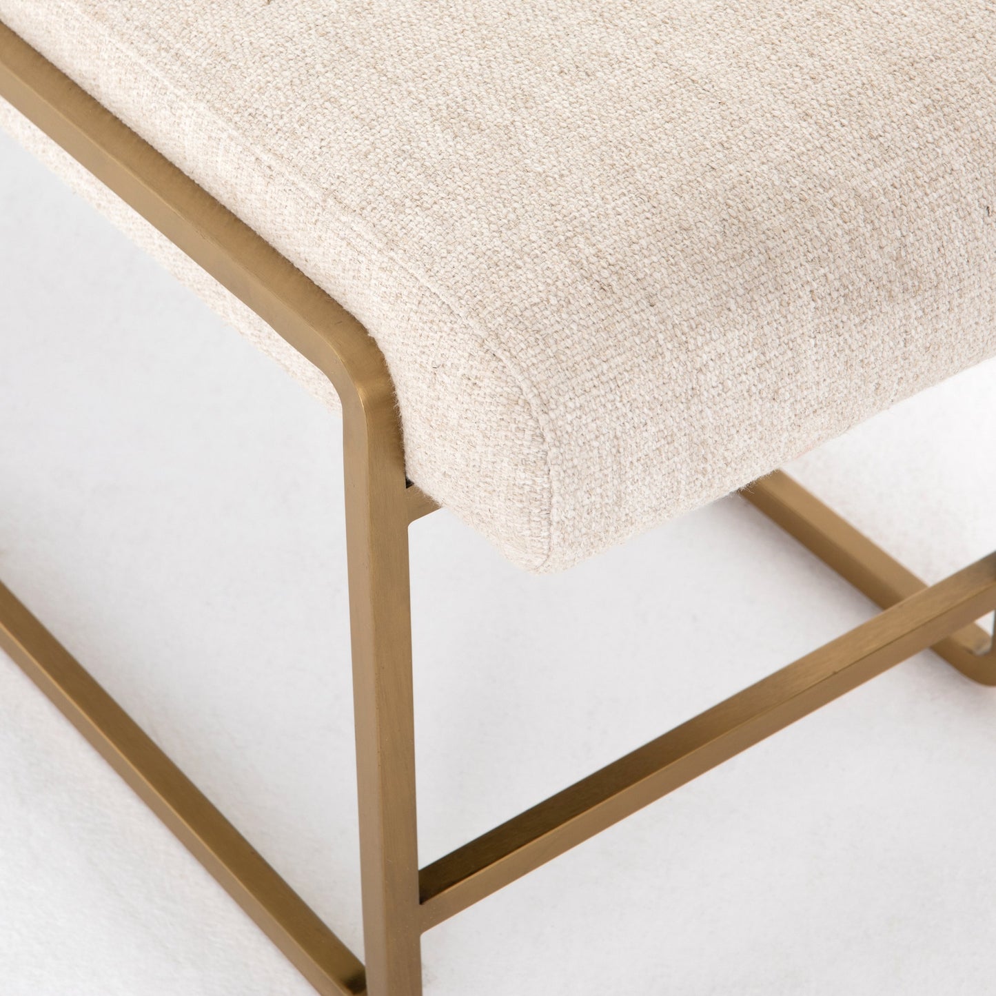 029 SR-810021 | Closeup | Sled Bench by Four Hands in thames cream. Made from 66% polyester, 19% acrylic, 15% flax, linen, stainless steel, poplar plywood in a modern style.