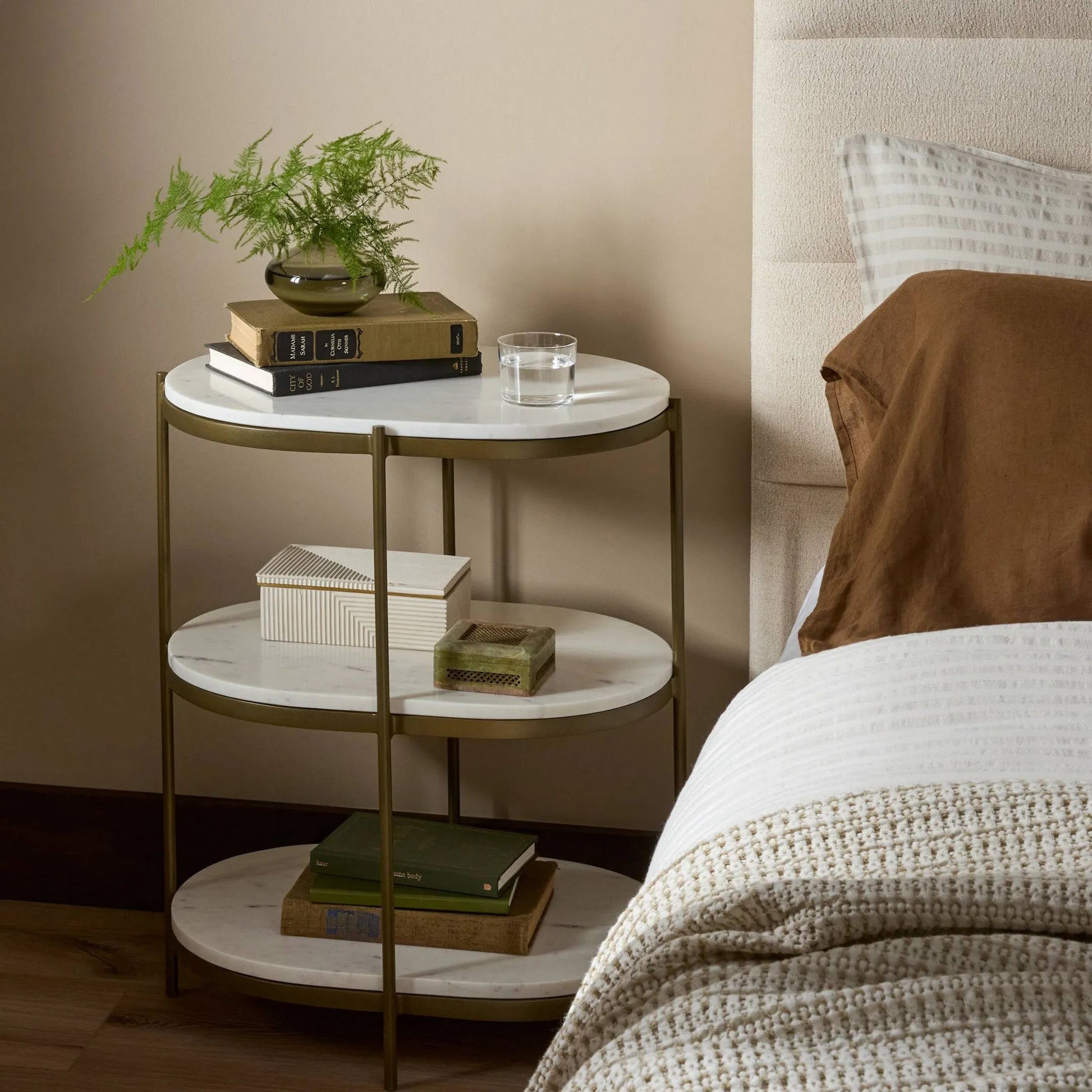 Felix Oval Nightstand by Four Hands in antique brass, polished white marble. Made from iron, solid marble in a modern style.