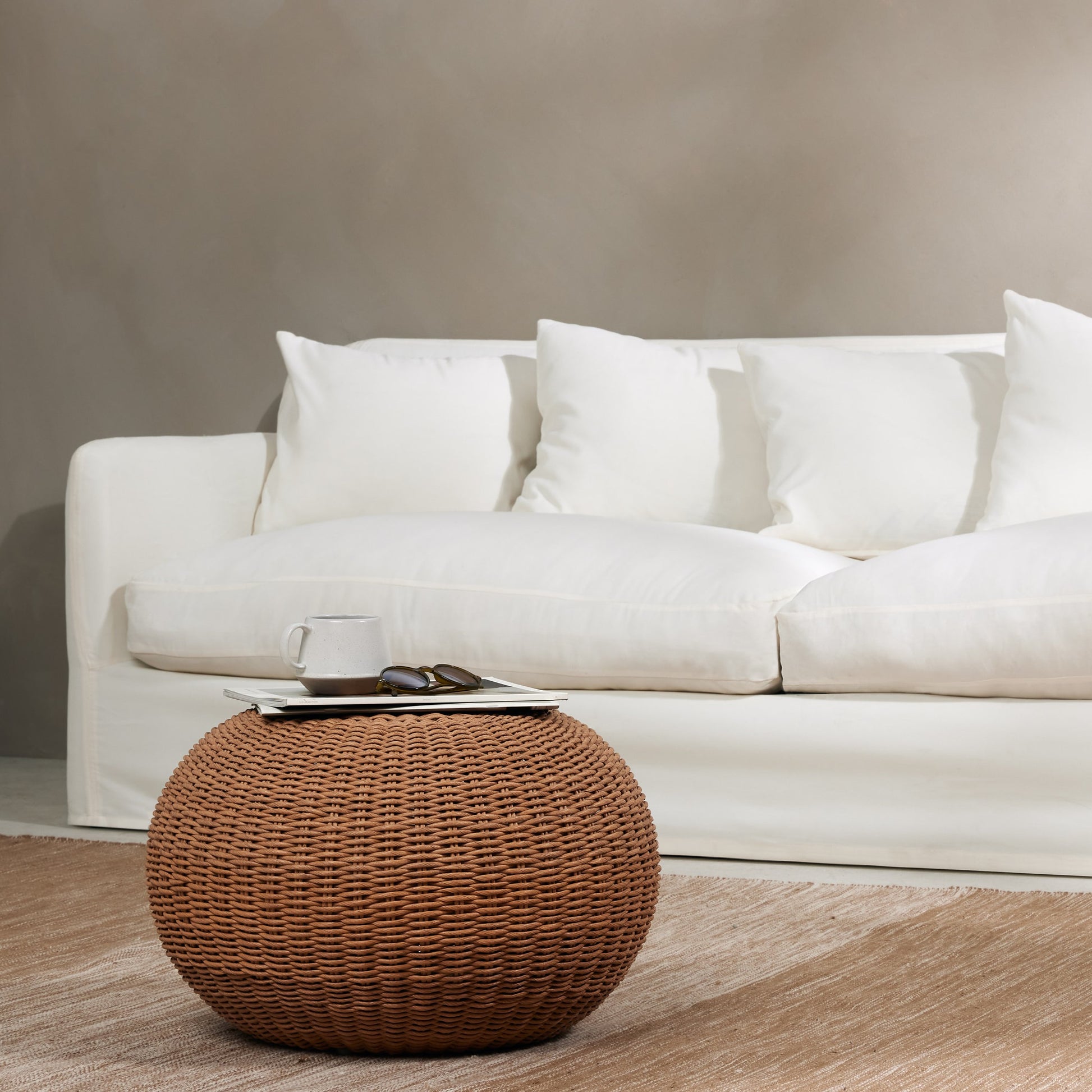 Phoenix Outdoor Accent Stool by Four Hands in vintage white. Made from 100% polyethylene, aluminum in a coastal style.