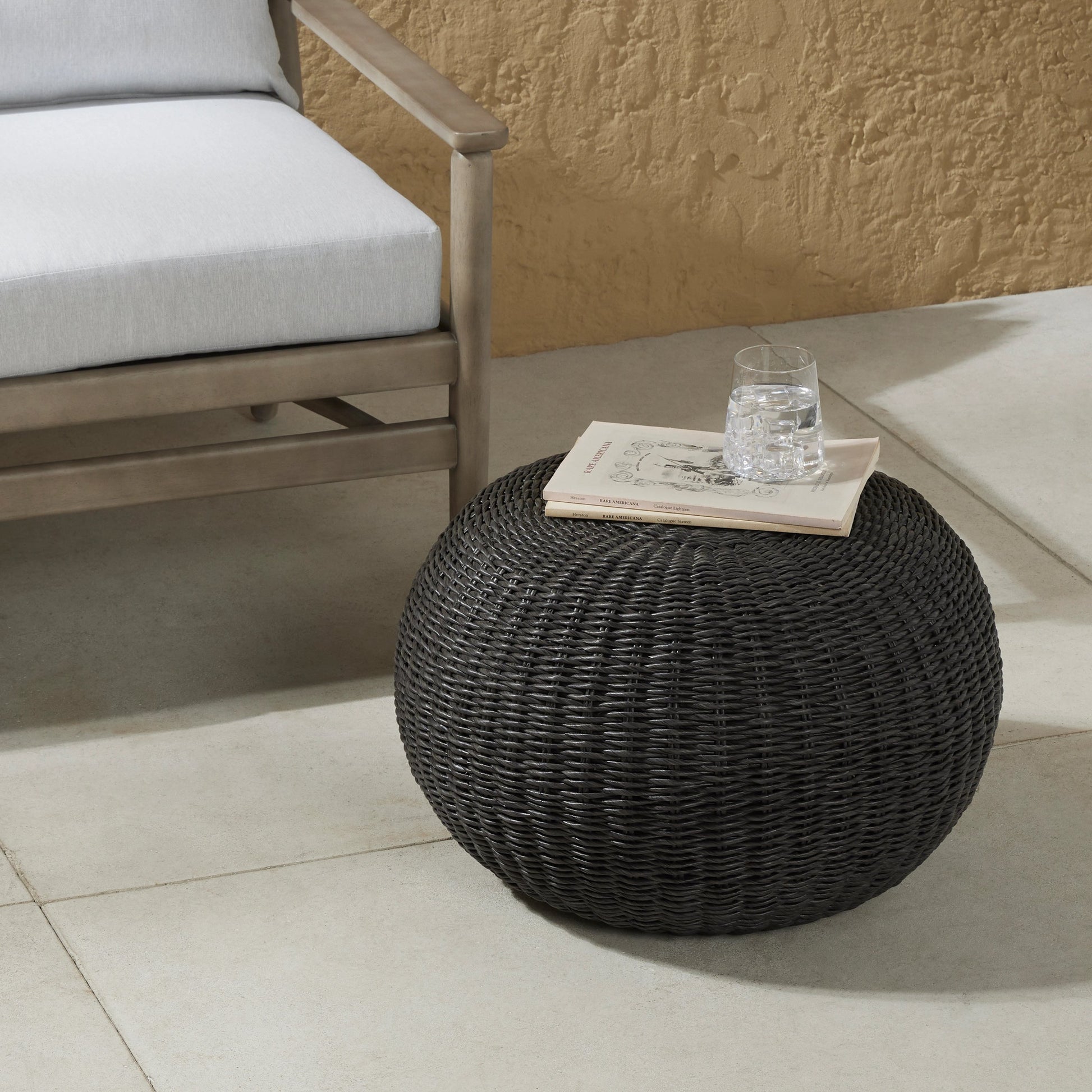 Phoenix Outdoor Accent Stool by Four Hands in vintage white. Made from 100% polyethylene, aluminum in a coastal style.