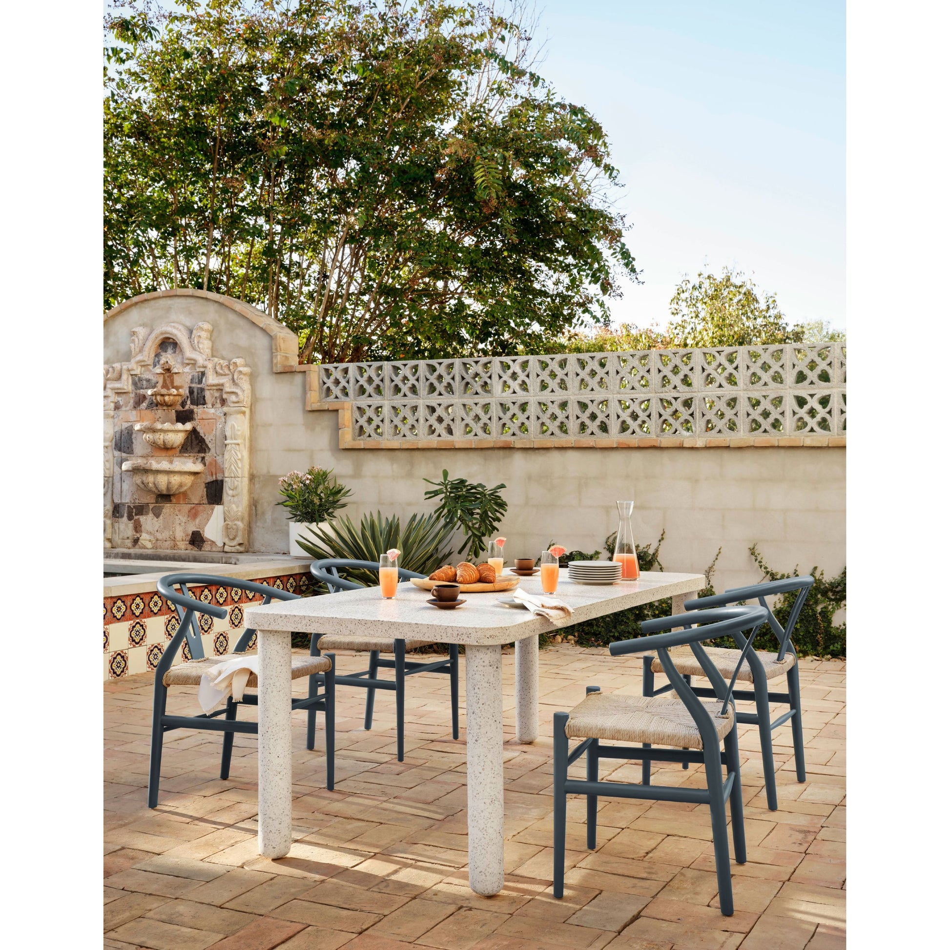 Muestra Dining Chair by Four Hands. Made from solid teak, 100% polyethylene in a coastal style.