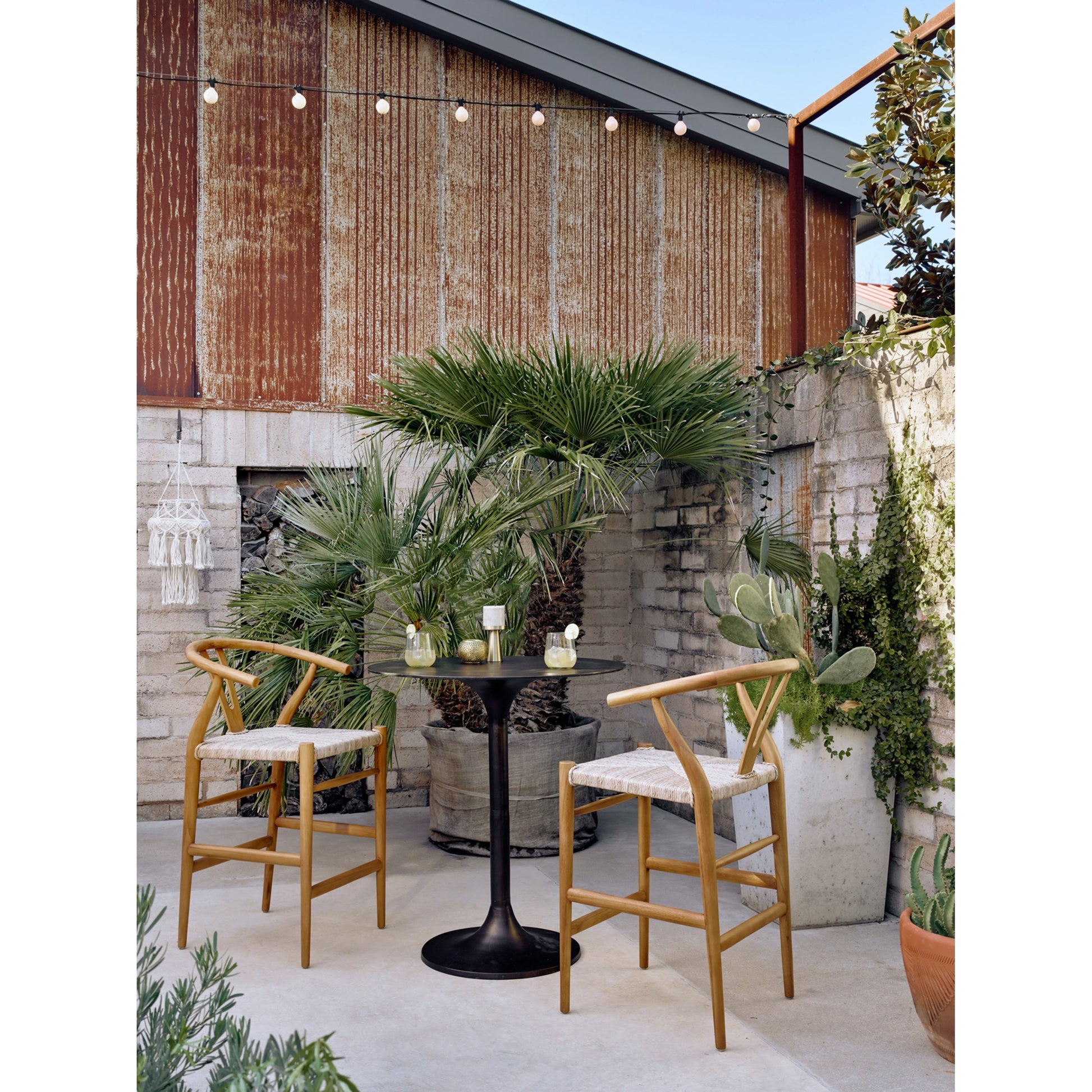 Muestra Counter Stool by Four Hands in vintage white, black teak. Made from solid teak, 100% polyethylene in a coastal style.
