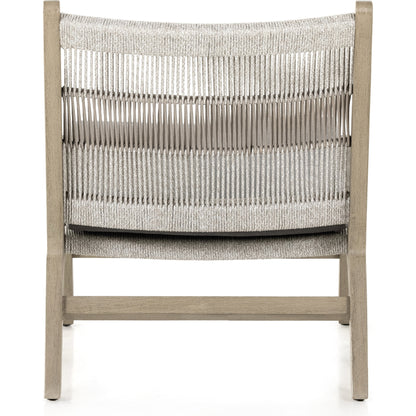 Julian Outdoor Chair by Four Hands. Made from 100% olefin, solid fsc®-certified teak, 100% polypropylene in a modern style.