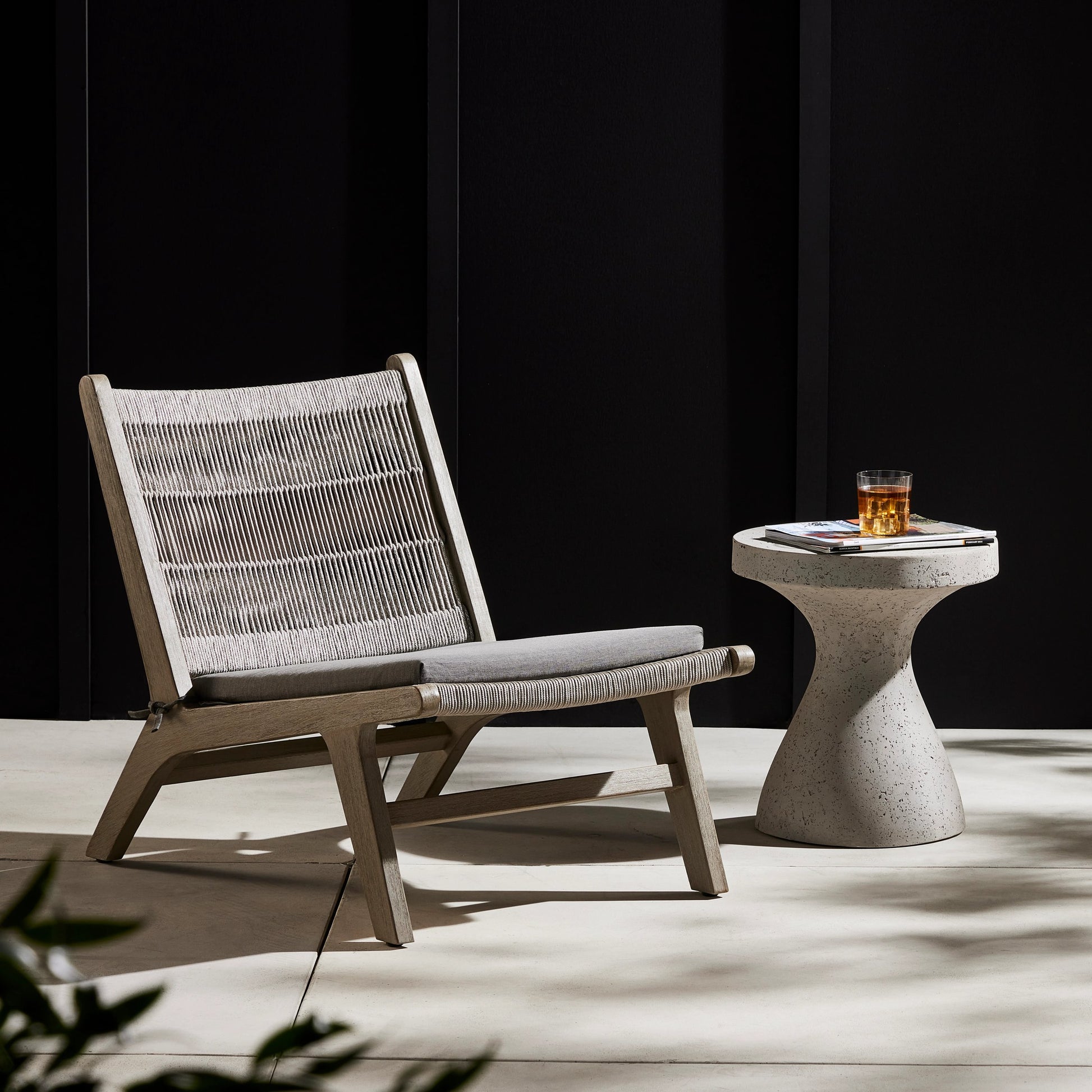Julian Outdoor Chair by Four Hands. Made from 100% olefin, solid fsc®-certified teak, 100% polypropylene in a modern style.