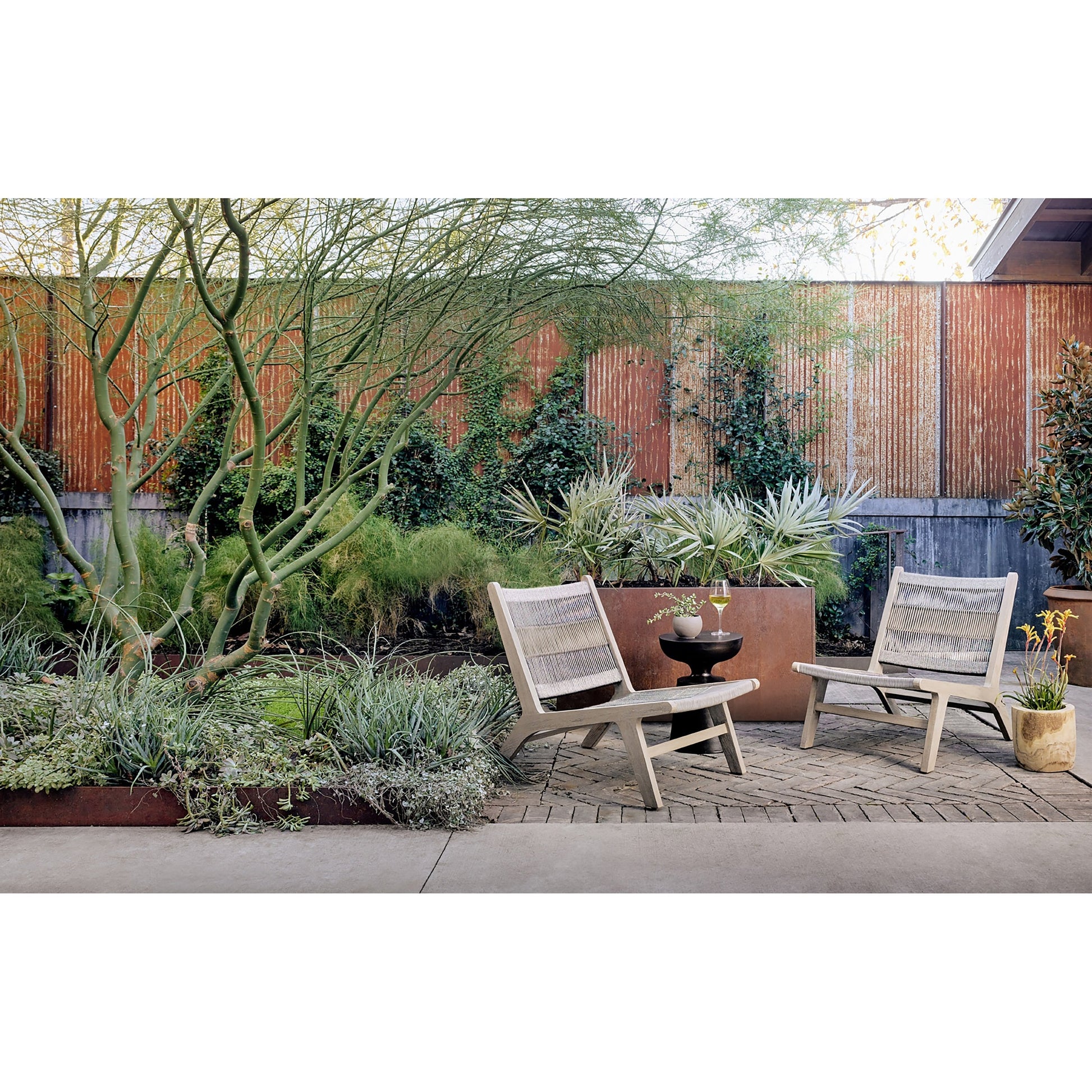 Julian Outdoor Chair by Four Hands. Made from 100% olefin, solid fsc®-certified teak, 100% polypropylene in a modern style.