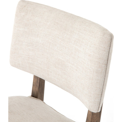 Orville Dining Chair by Four Hands in cambric ivory. Made from 90% polyester, 10% flax, linen, solid parawood, iron in a modern style.