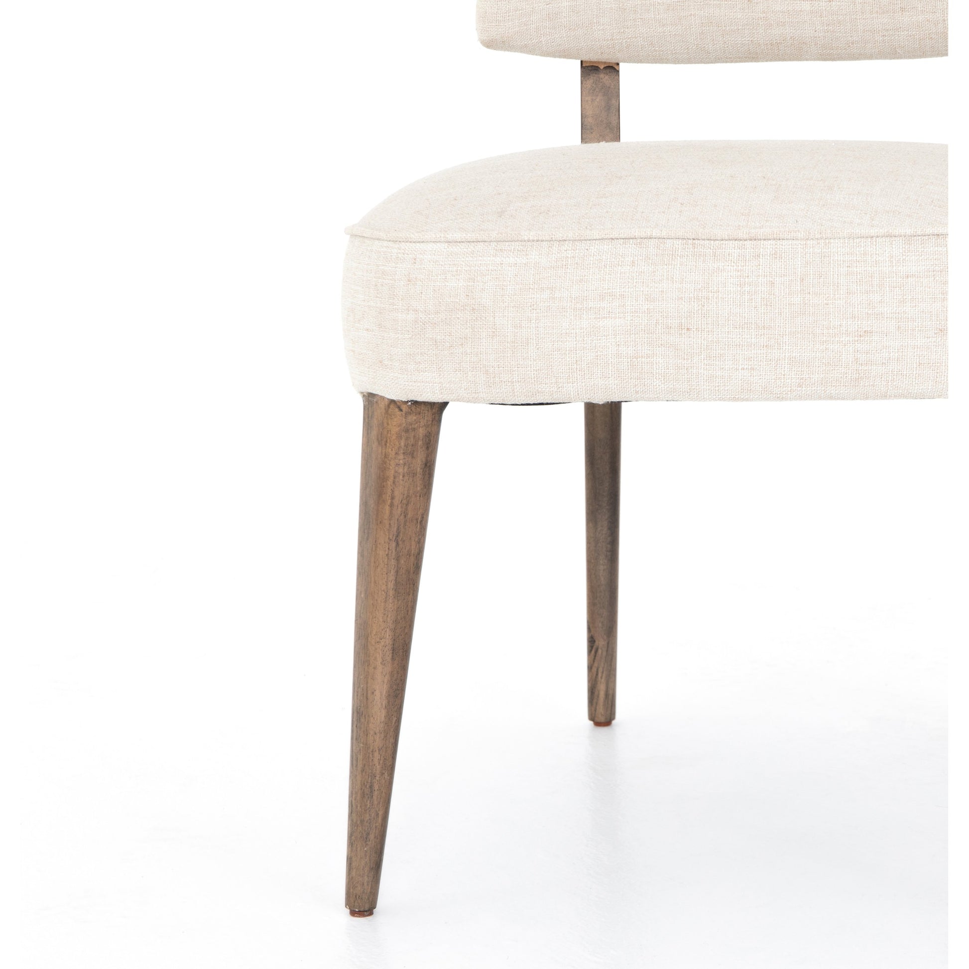 Orville Dining Chair by Four Hands in cambric ivory. Made from 90% polyester, 10% flax, linen, solid parawood, iron in a modern style.