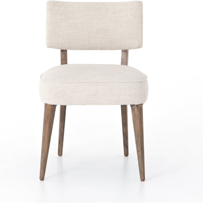 Orville Dining Chair by Four Hands in cambric ivory. Made from 90% polyester, 10% flax, linen, solid parawood, iron in a modern style.