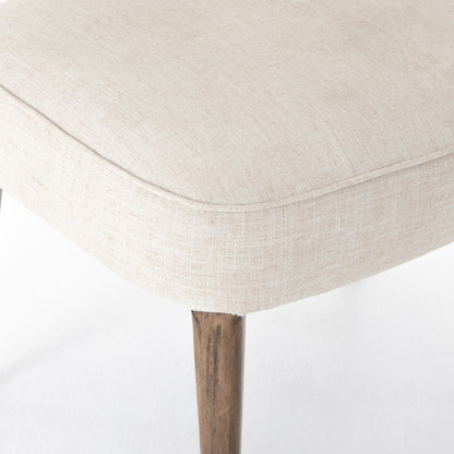 Orville Dining Chair by Four Hands in cambric ivory. Made from 90% polyester, 10% flax, linen, solid parawood, iron in a modern style.