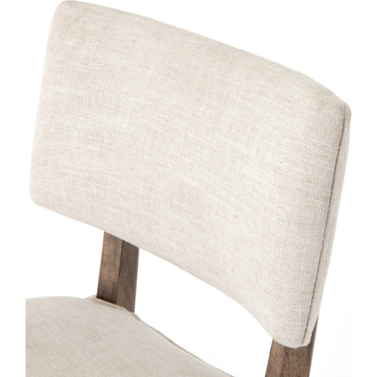 Orville Dining Chair by Four Hands in cambric ivory. Made from 90% polyester, 10% flax, linen, solid parawood, iron in a modern style.