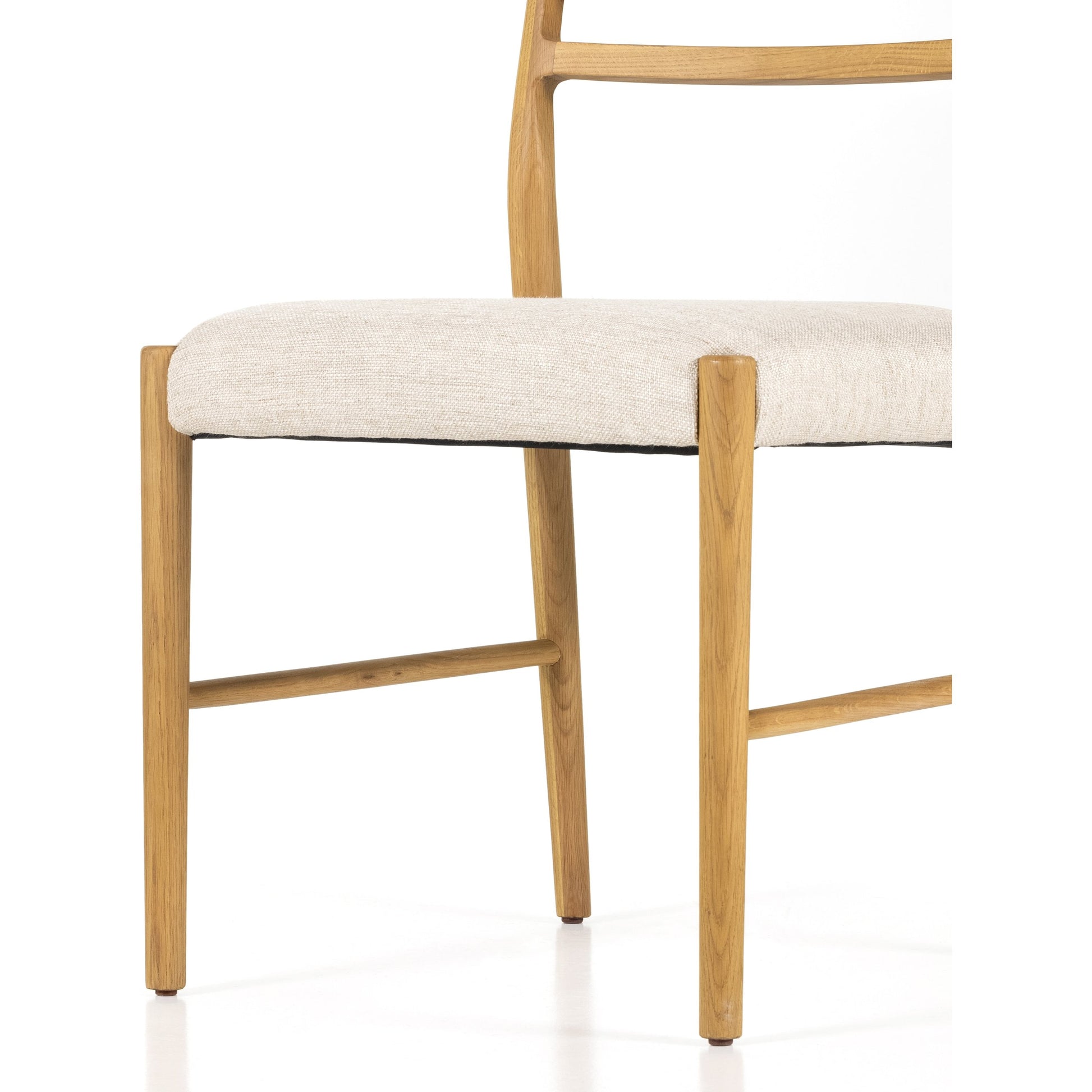 Glenmore Dining Chair by Four Hands. Made from 49% viscose (rayon), 22% flax, linen, 18% polyester, 11% cotton, solid oak, 100% polyester in a transitional style.