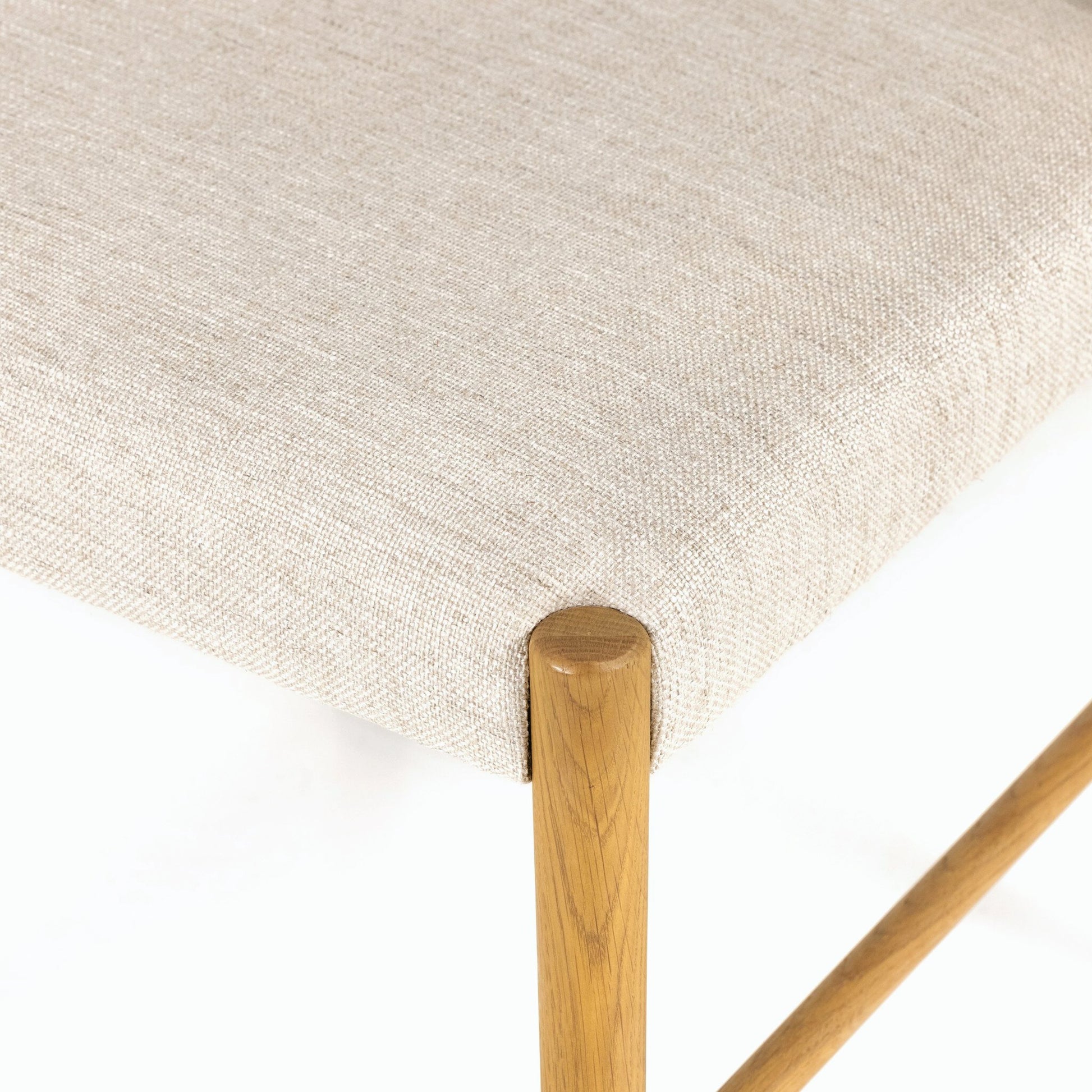 Glenmore Dining Chair by Four Hands. Made from 49% viscose (rayon), 22% flax, linen, 18% polyester, 11% cotton, solid oak, 100% polyester in a transitional style.