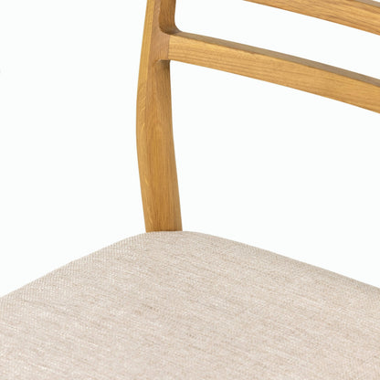 Glenmore Dining Chair by Four Hands. Made from 49% viscose (rayon), 22% flax, linen, 18% polyester, 11% cotton, solid oak, 100% polyester in a transitional style.