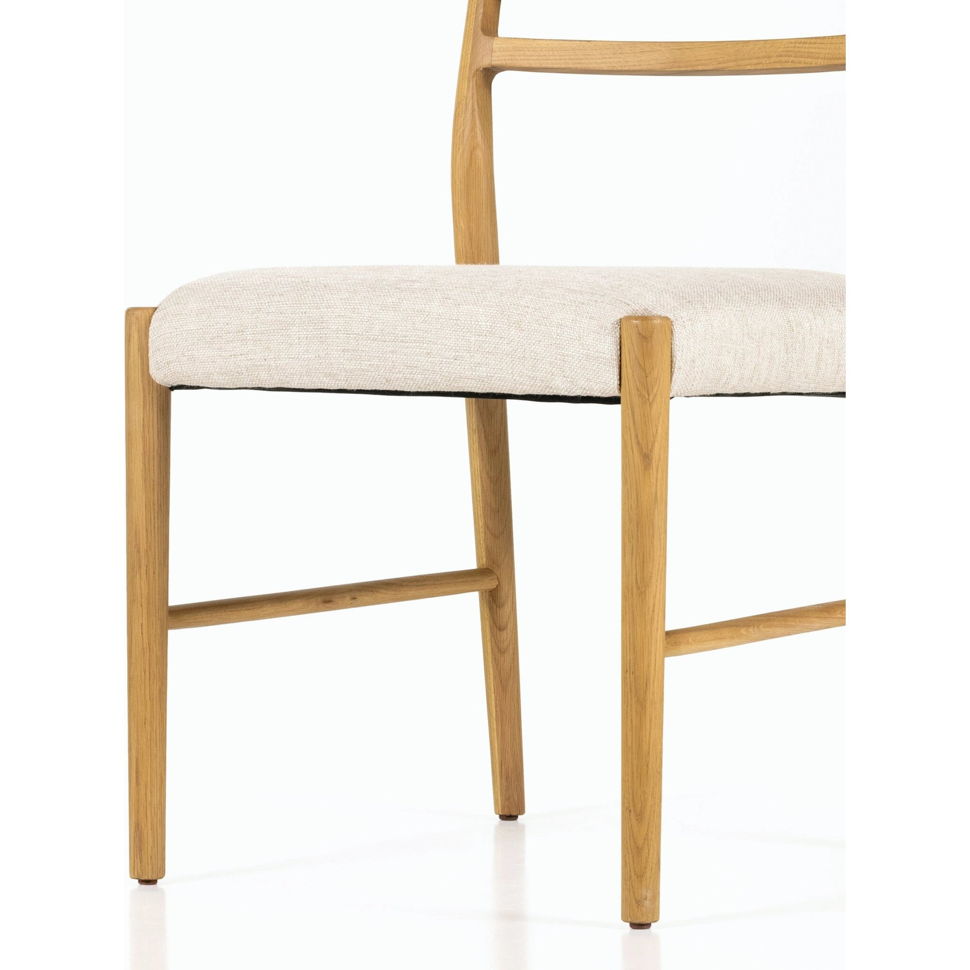 Glenmore Dining Chair by Four Hands. Made from 49% viscose (rayon), 22% flax, linen, 18% polyester, 11% cotton, solid oak, 100% polyester in a transitional style.