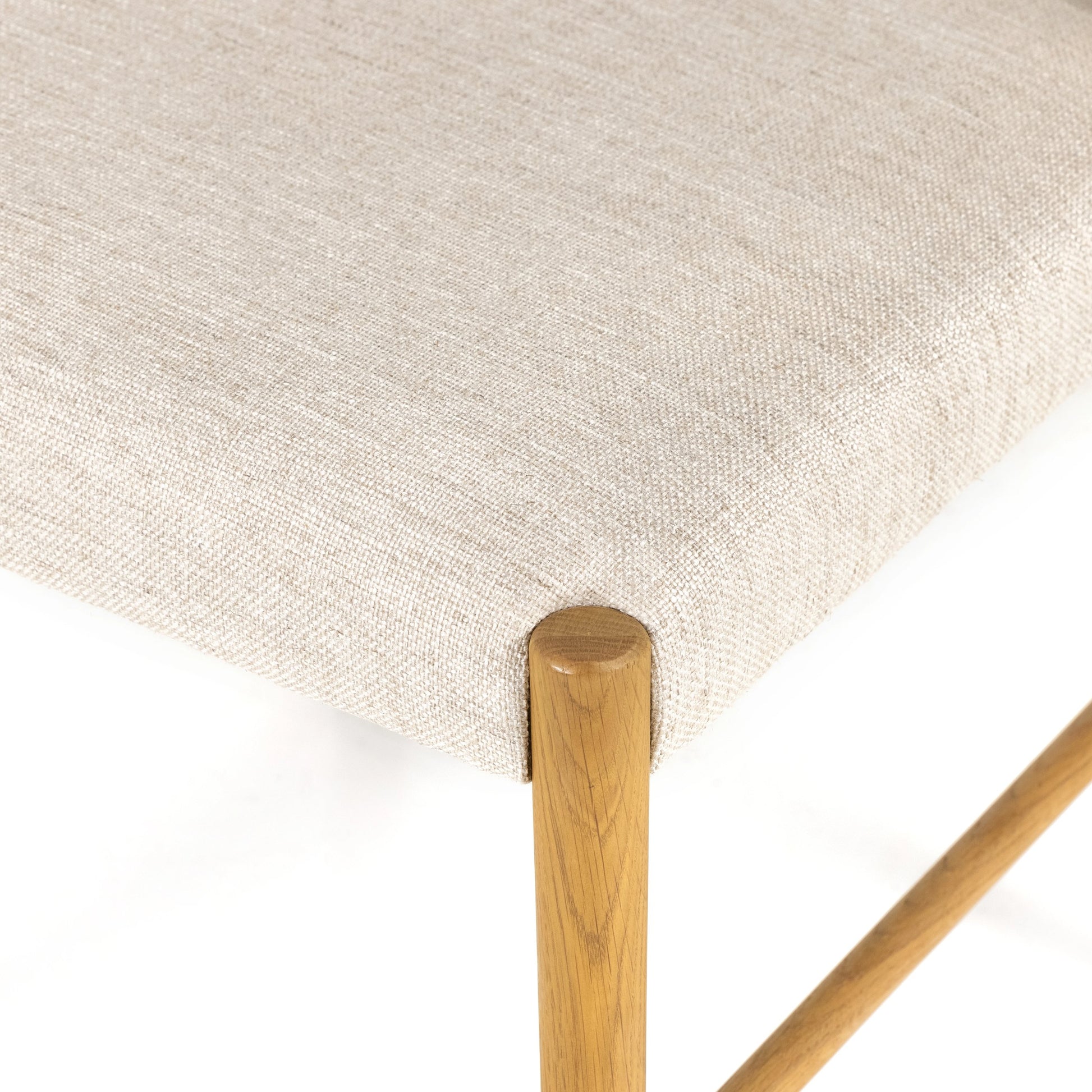 Glenmore Dining Chair by Four Hands. Made from 49% viscose (rayon), 22% flax, linen, 18% polyester, 11% cotton, solid oak, 100% polyester in a transitional style.