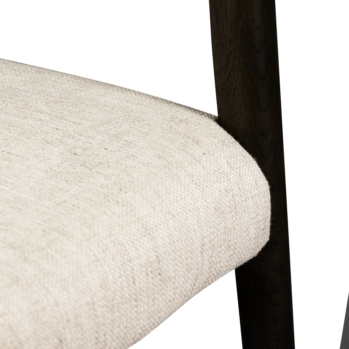 012 SI-1977340 | Closeup | Glenmore Dining Chair by Four Hands. Made from 49% viscose (rayon), 22% flax, linen, 18% polyester, 11% cotton, solid oak, 100% polyester in a transitional style.