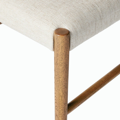 Glenmore Dining Chair by Four Hands. Made from 49% viscose (rayon), 22% flax, linen, 18% polyester, 11% cotton, solid oak, 100% polyester in a transitional style.