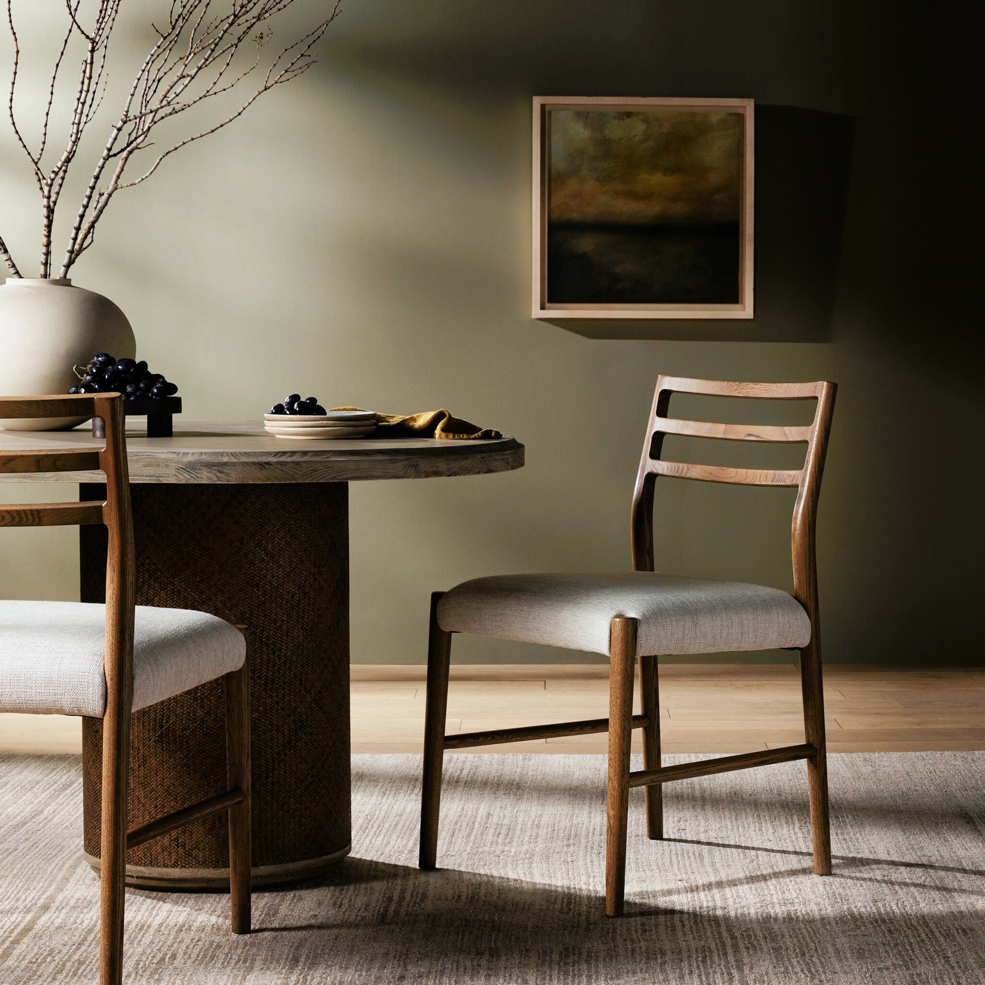 Glenmore Dining Chair by Four Hands. Made from 49% viscose (rayon), 22% flax, linen, 18% polyester, 11% cotton, solid oak, 100% polyester in a transitional style.
