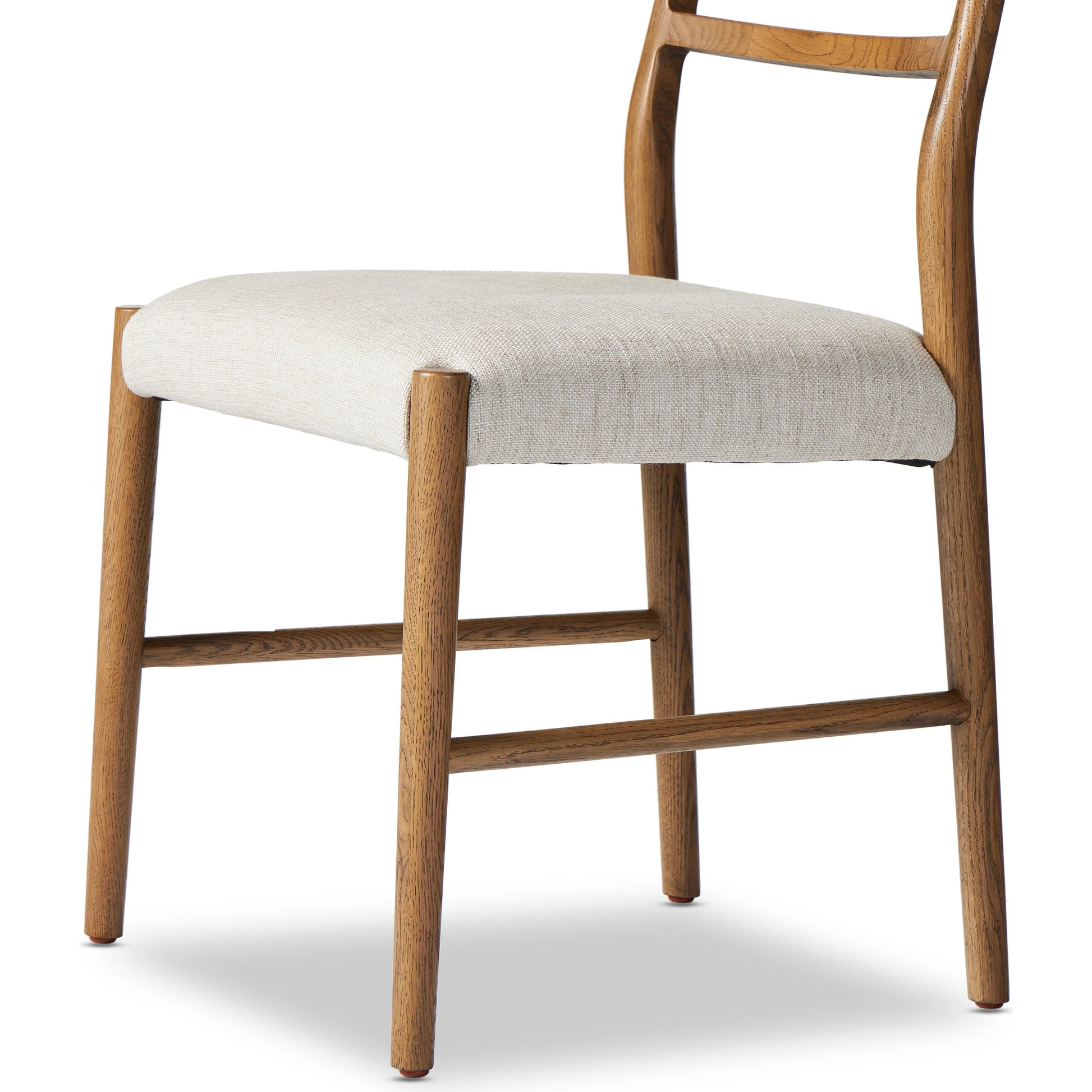 Glenmore Dining Chair by Four Hands. Made from 49% viscose (rayon), 22% flax, linen, 18% polyester, 11% cotton, solid oak, 100% polyester in a transitional style.