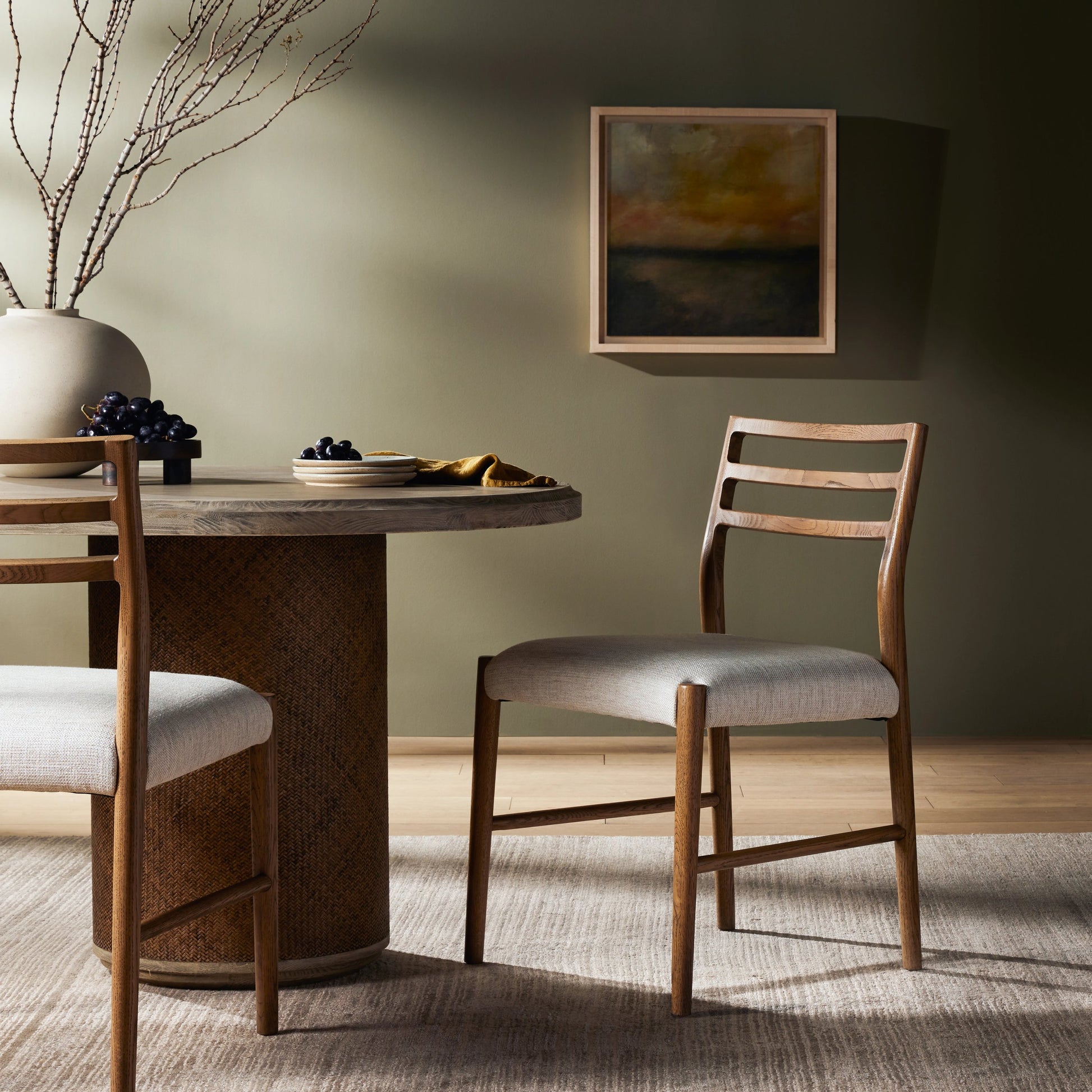 Glenmore Dining Chair by Four Hands. Made from 49% viscose (rayon), 22% flax, linen, 18% polyester, 11% cotton, solid oak, 100% polyester in a transitional style.