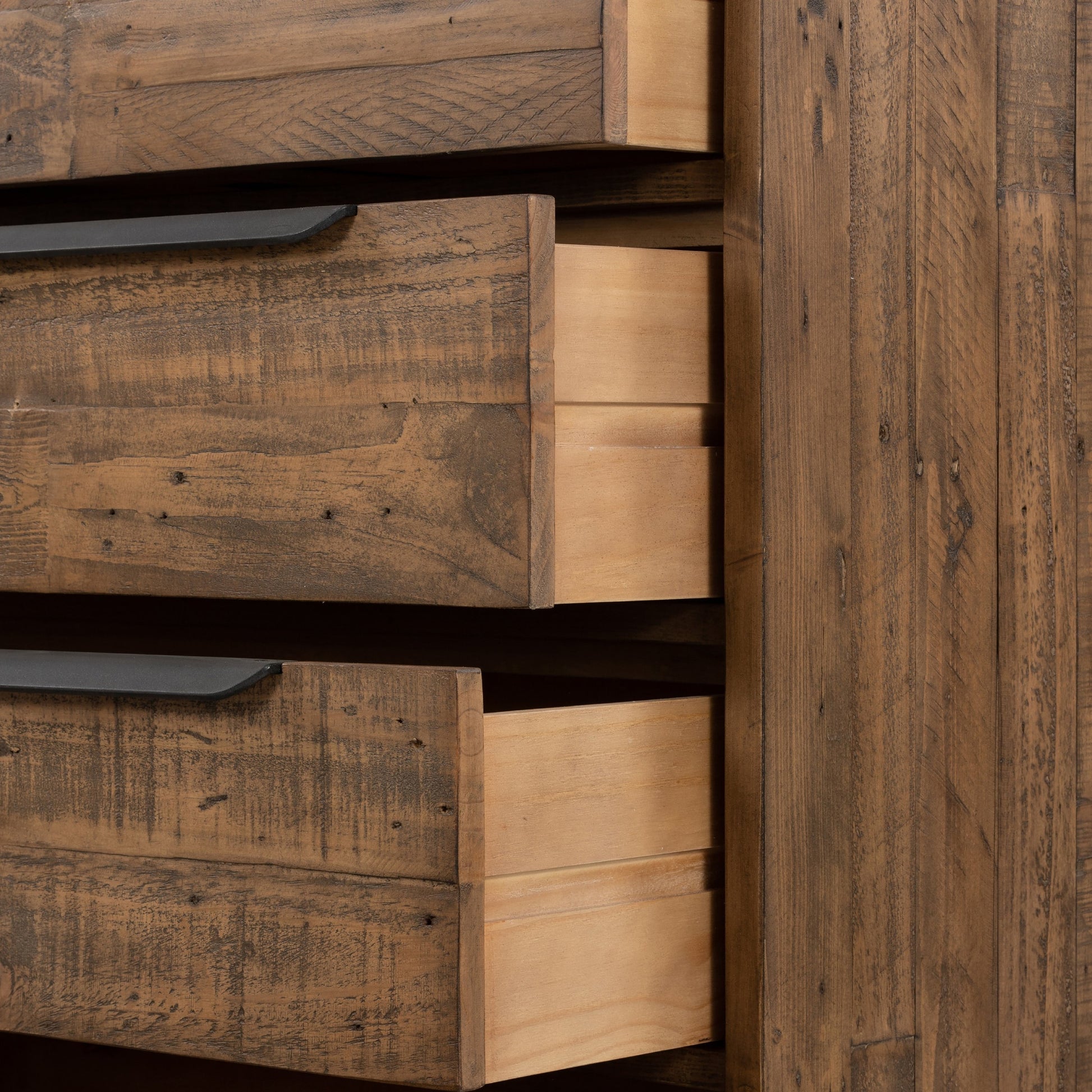 Wyeth 5 Drawer Dresser by Four Hands in dark carbon, antique brass and dark carbon. Made from solid reclaimed pine, iron in a rustic style.