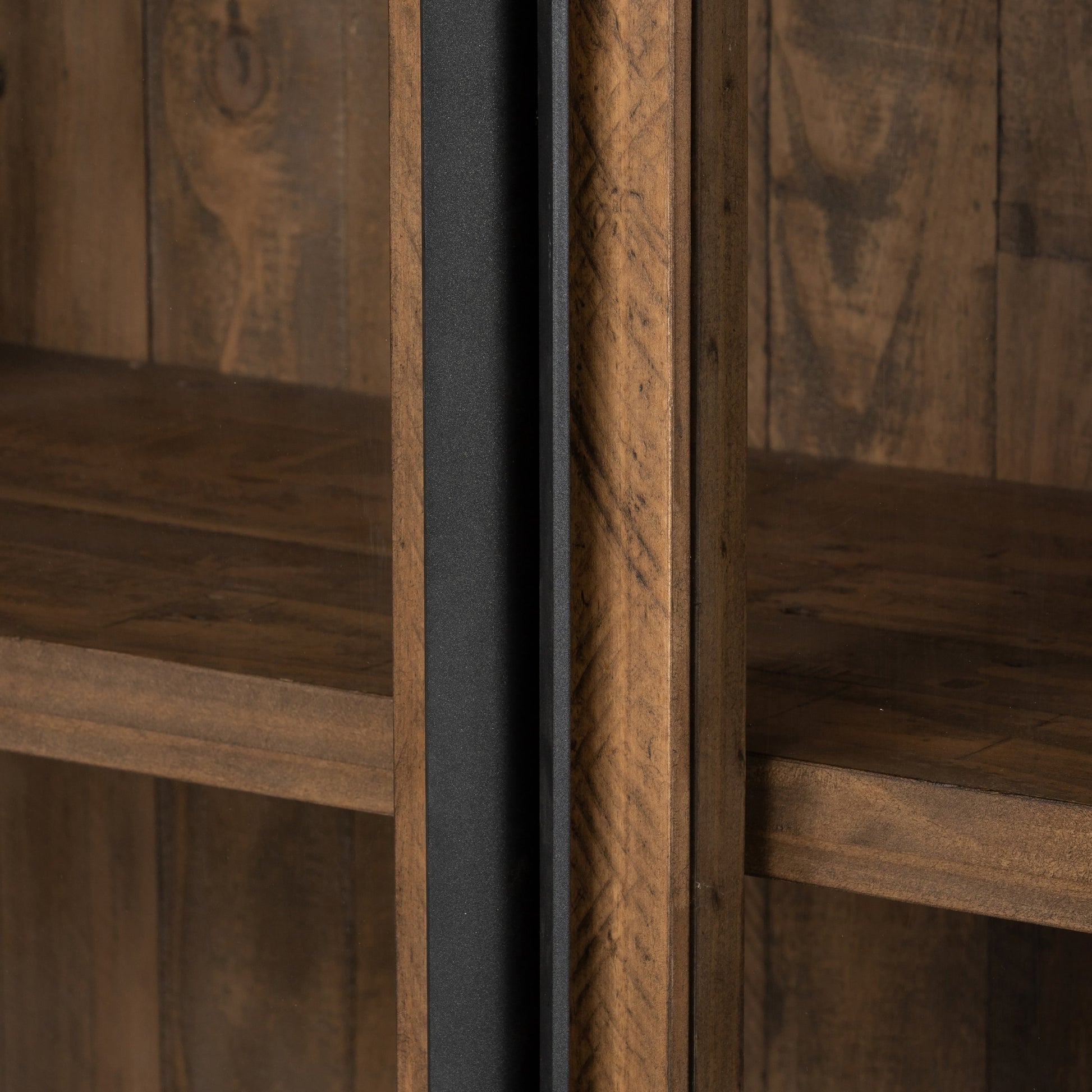 Wyeth Cabinet by Four Hands in dark carbon, tempered glass, antique brass and dark carbon. Made from solid reclaimed pine, iron in a modern style.