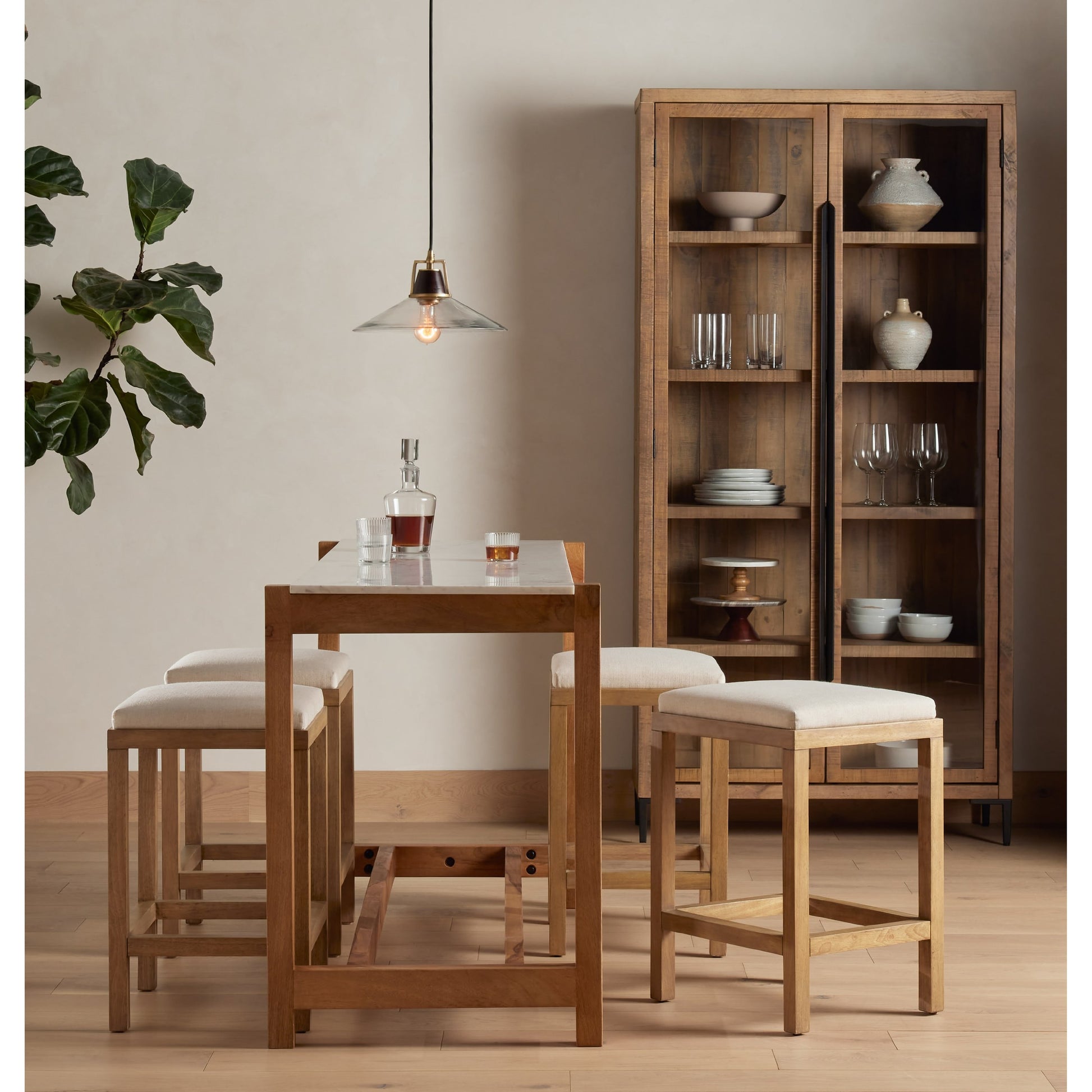 Wyeth Cabinet by Four Hands in dark carbon, tempered glass, antique brass and dark carbon. Made from solid reclaimed pine, iron in a modern style.