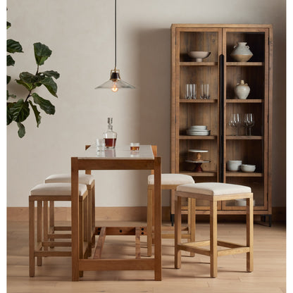 Wyeth Cabinet by Four Hands in dark carbon, tempered glass, antique brass and dark carbon. Made from solid reclaimed pine, iron in a modern style.