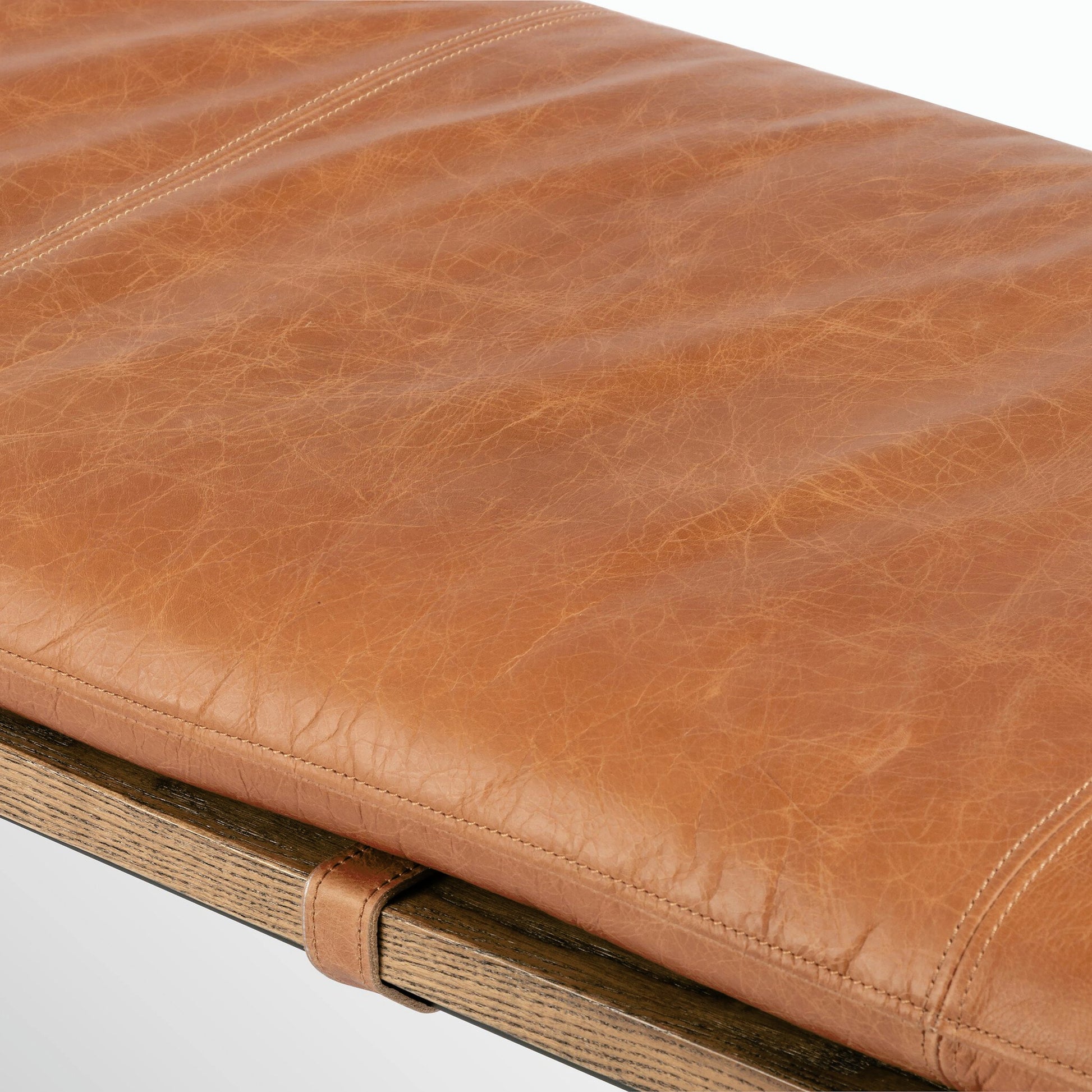 Gabine Accent Bench by Four Hands in brandy and midnight iron, toasted nettlewood. Made from top grain leather, iron, solid nettlewood in a modern style.