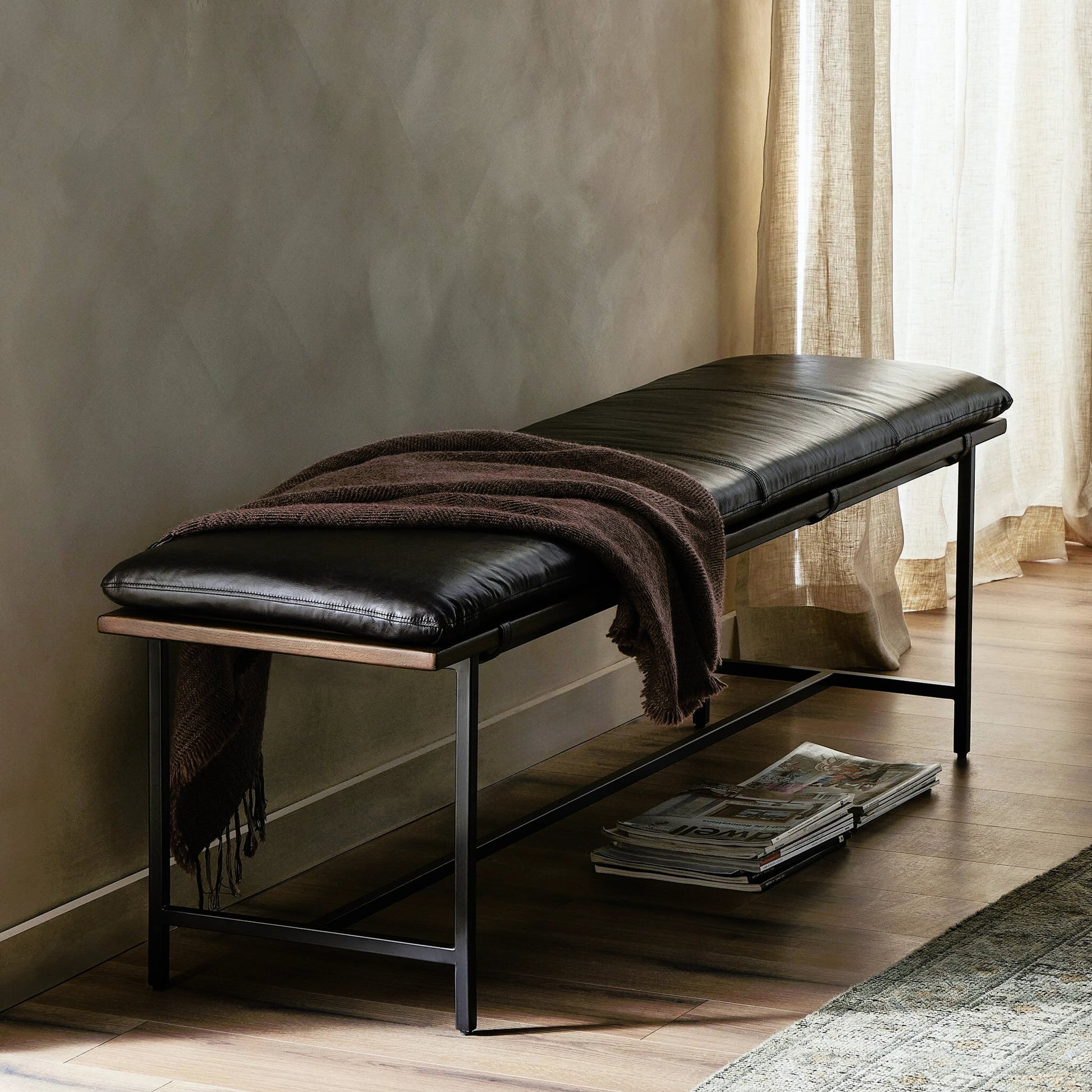 Gabine Accent Bench by Four Hands in brandy and midnight iron, toasted nettlewood. Made from top grain leather, iron, solid nettlewood in a modern style.