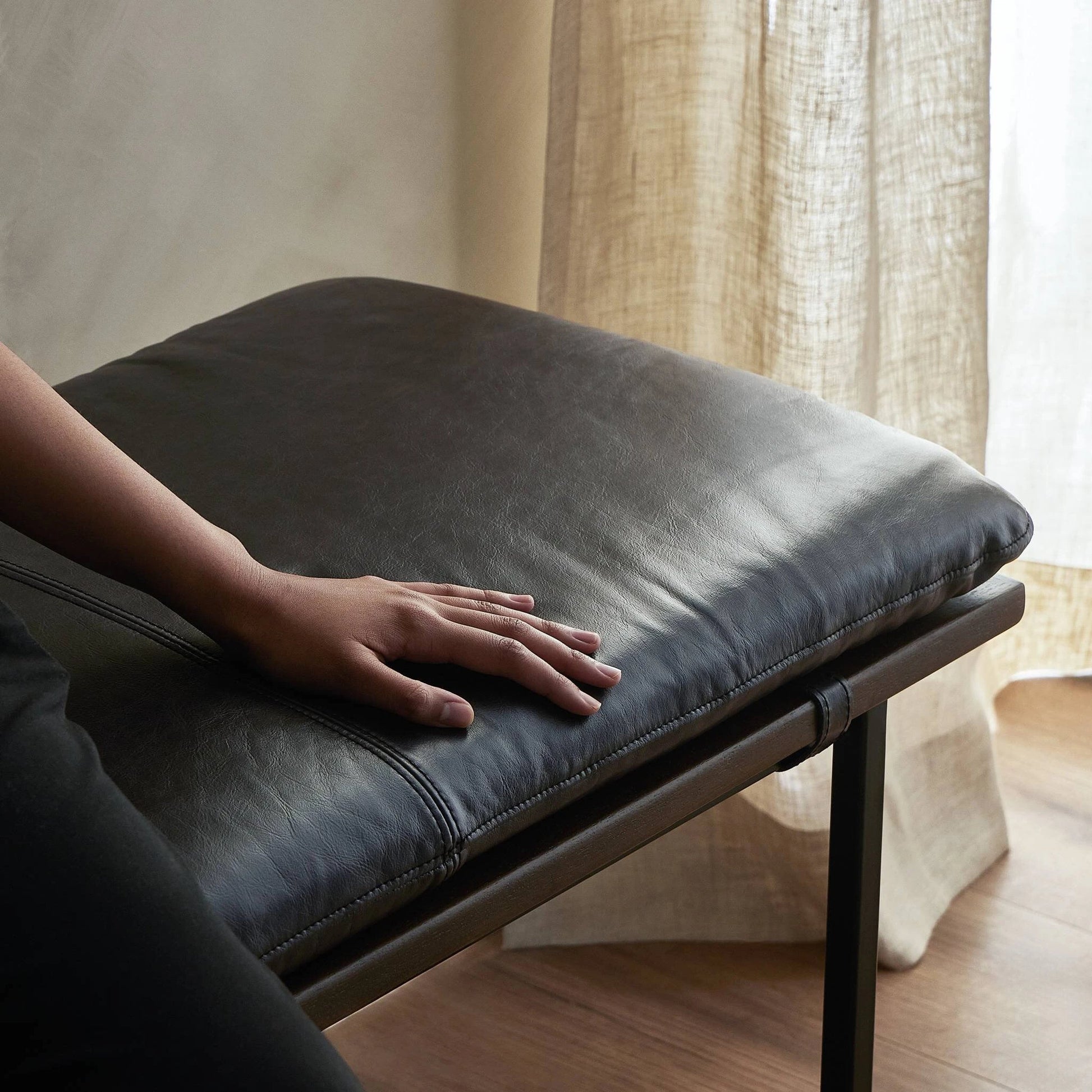 Gabine Accent Bench by Four Hands in brandy and midnight iron, toasted nettlewood. Made from top grain leather, iron, solid nettlewood in a modern style.