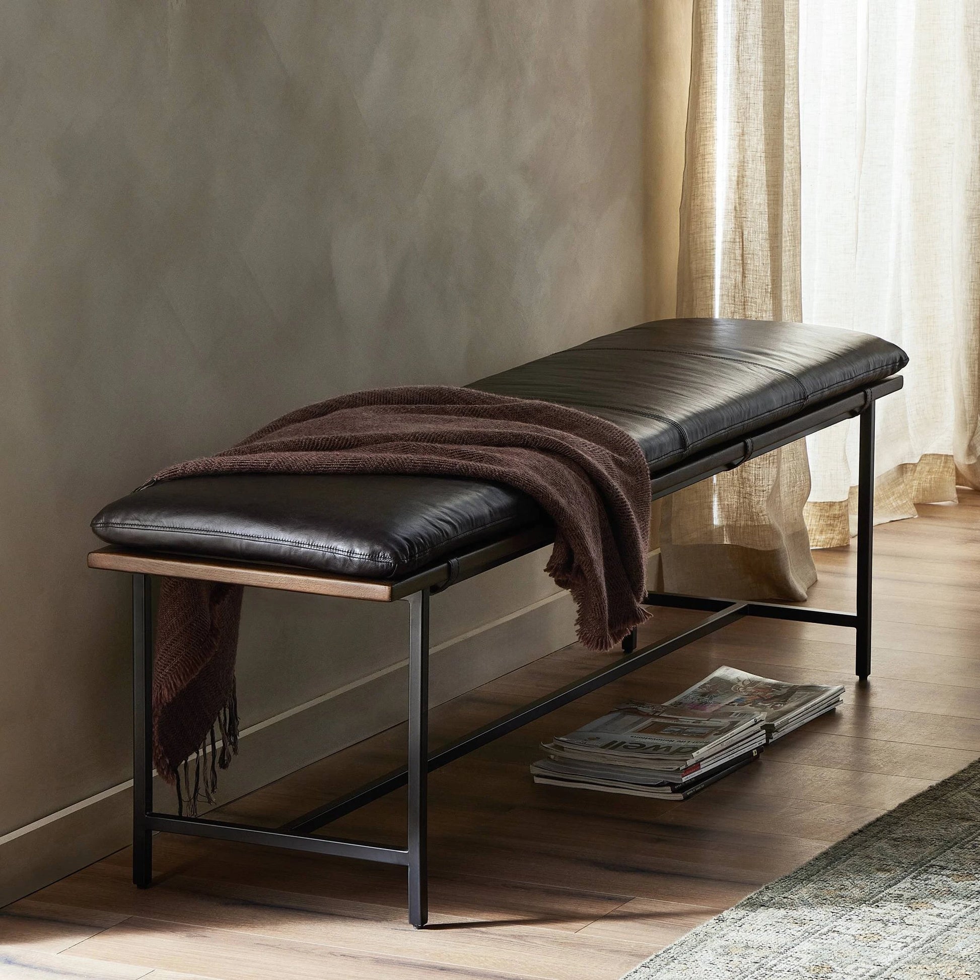 Gabine Accent Bench by Four Hands in brandy and midnight iron, toasted nettlewood. Made from top grain leather, iron, solid nettlewood in a modern style.