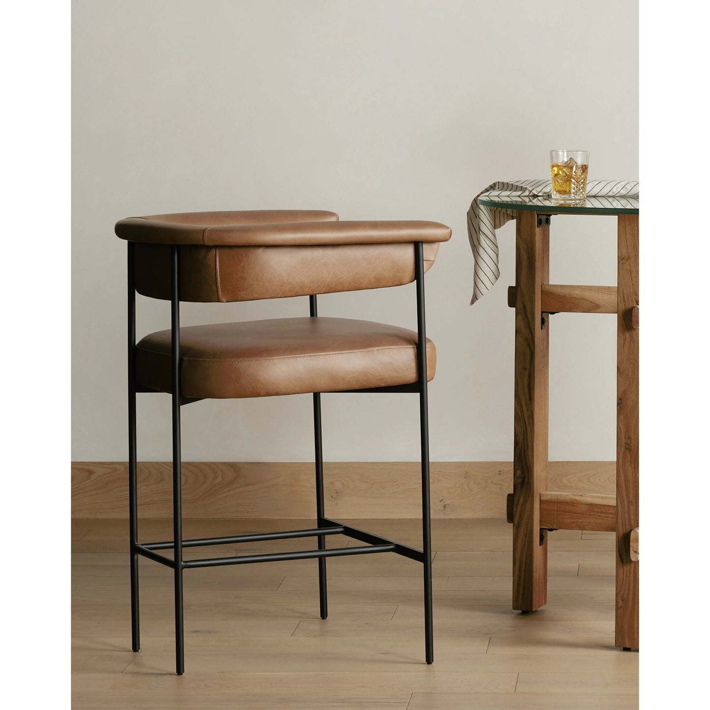 049 SI-1902814 | Lifestyle | Carrie Counter Stool by Four Hands in matte black. Made from unique in a transitional style.