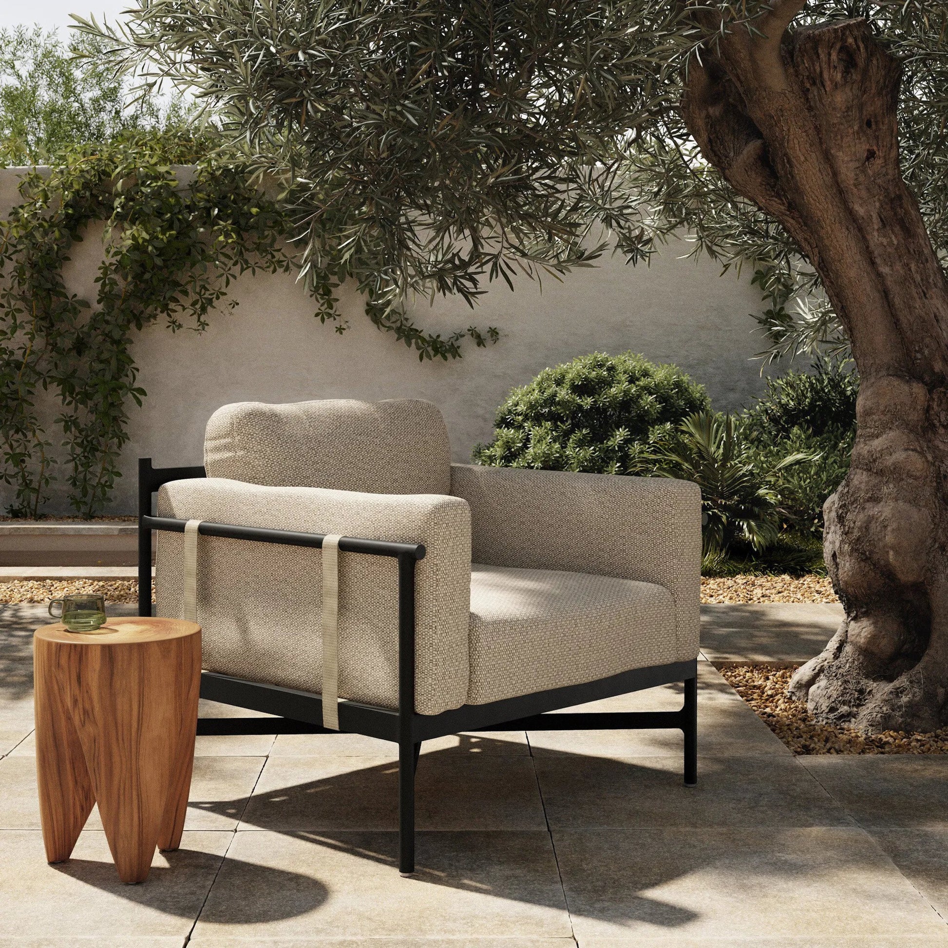 Hearst Outdoor Chair by Four Hands in bronze. Made from 100% olefin, aluminum, 100% polypropylene in a modern style.