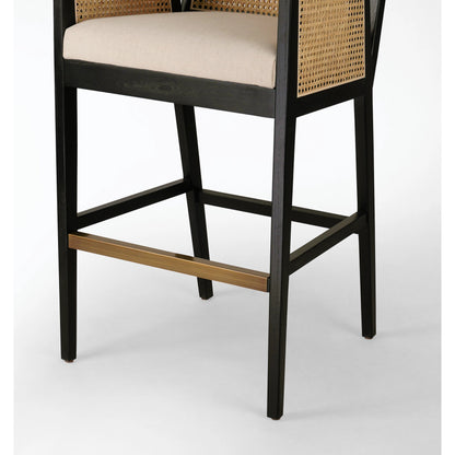 Antonia Bar Stool by Four Hands in light natural cane, brushed ebony, brass kickplate, savile flax. Made from 92% polyester, 8% flax, linen, solid nettlewood, iron in a modern style.