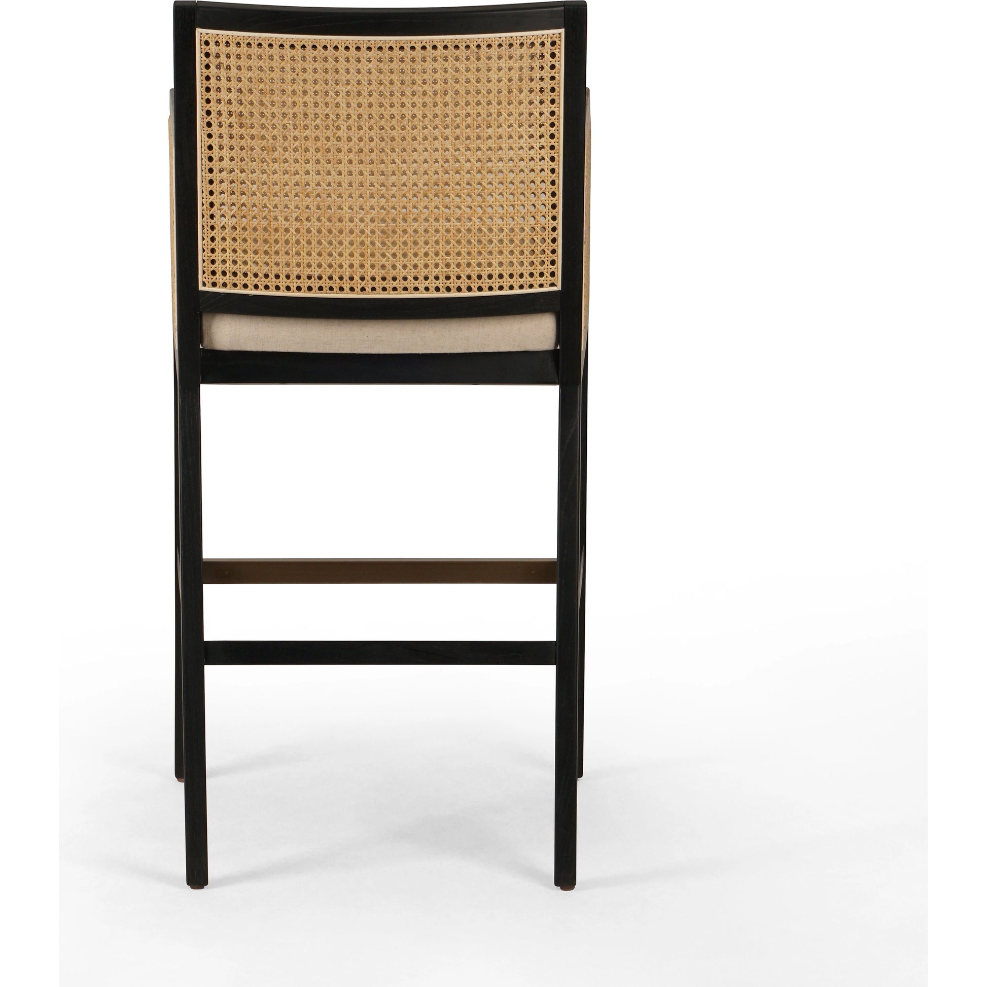 Antonia Bar Stool by Four Hands in light natural cane, brushed ebony, brass kickplate, savile flax. Made from 92% polyester, 8% flax, linen, solid nettlewood, iron in a modern style.