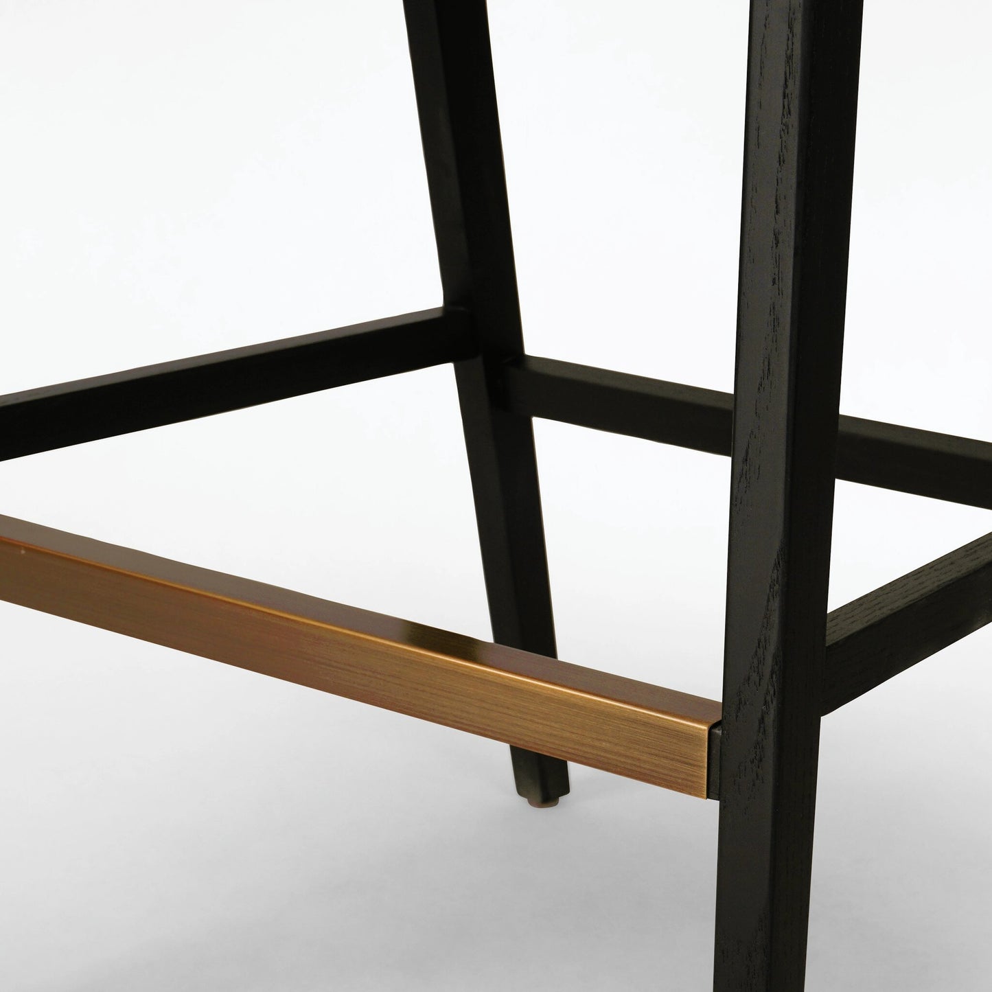 111 SI-1977036 | Closeup | Antonia Cane Counter Stool by Four Hands in sonoma black, brushed ebony. Made from top grain leather, solid nettlewood, iron in a modern style.