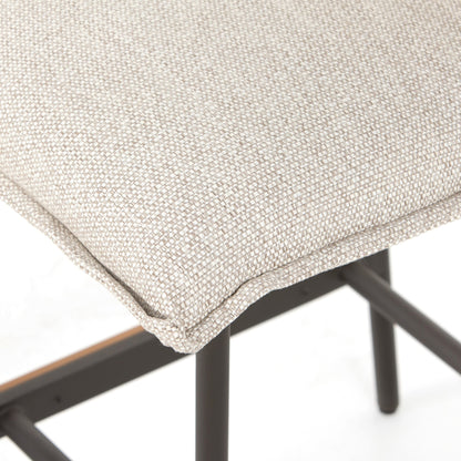 Vega Outdoor Counter Stool by Four Hands in faye sand. Made from 100% olefin, aluminum, solid fsc®-certified teak in a modern style.