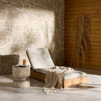 Kinta Outdoor Chaise by Four Hands in natural teak-fsc. Made from 100% olefin, solid fsc®-certified teak, 91% polyurethane foam pad, 9% polyester fiber batting in a rustic style.