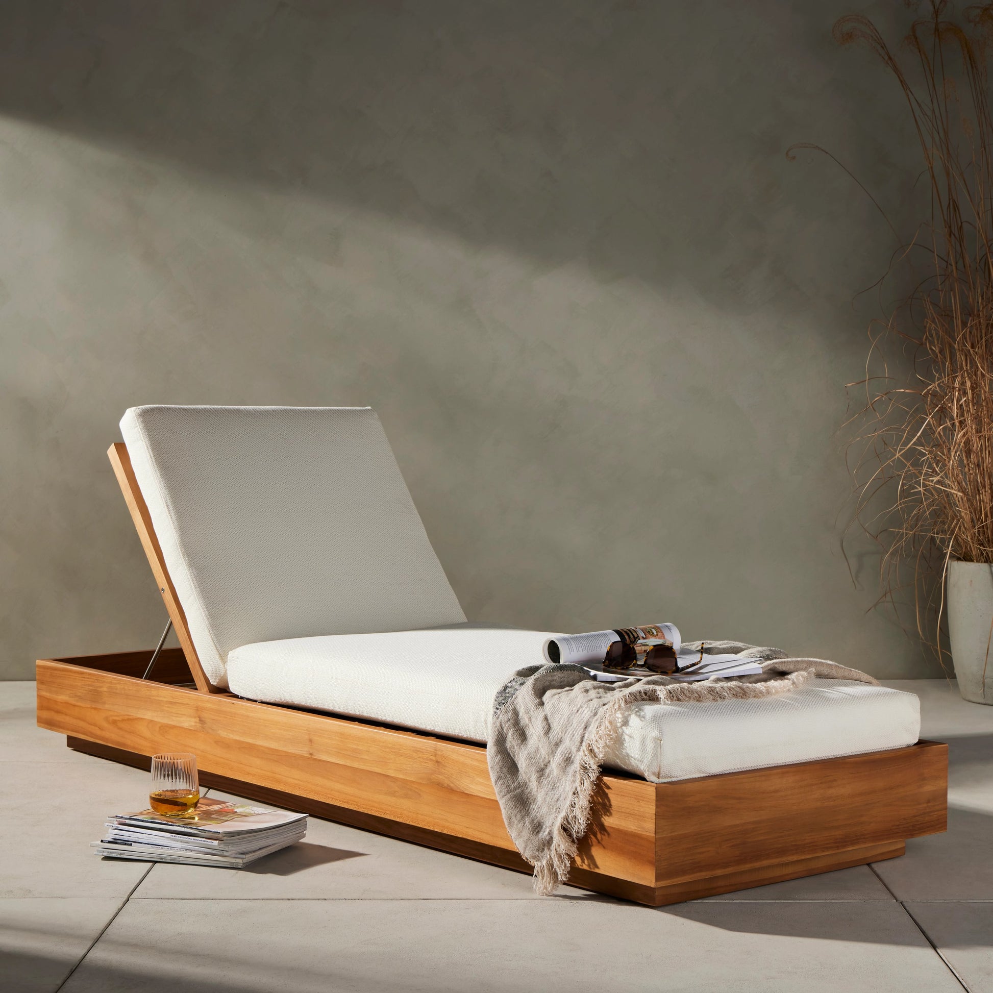 Kinta Outdoor Chaise by Four Hands in natural teak-fsc. Made from 100% olefin, solid fsc®-certified teak, 91% polyurethane foam pad, 9% polyester fiber batting in a rustic style.