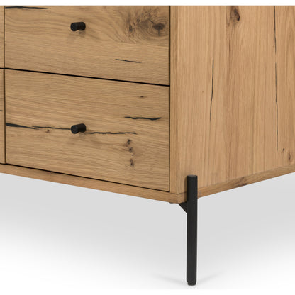 Eaton 9 Drawer Dresser by Four Hands in amber oak resin. Made from thick oak veneer, iron in a rustic style.