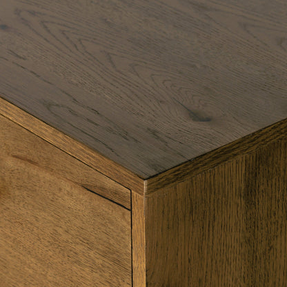 Eaton 9 Drawer Dresser by Four Hands in amber oak resin. Made from thick oak veneer, iron in a rustic style.