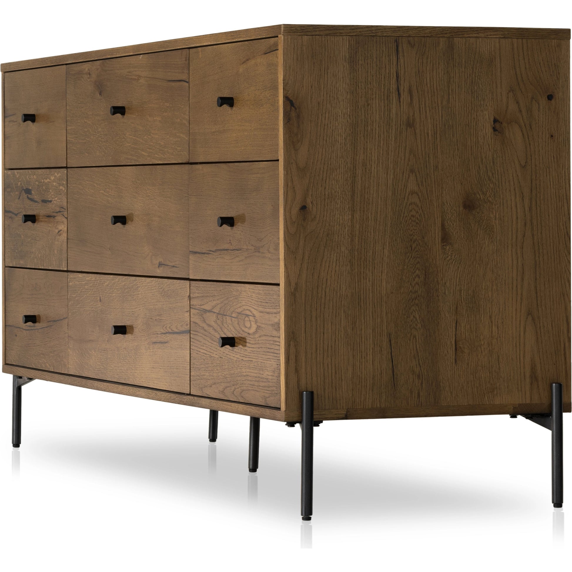 Eaton 9 Drawer Dresser by Four Hands in amber oak resin. Made from thick oak veneer, iron in a rustic style.