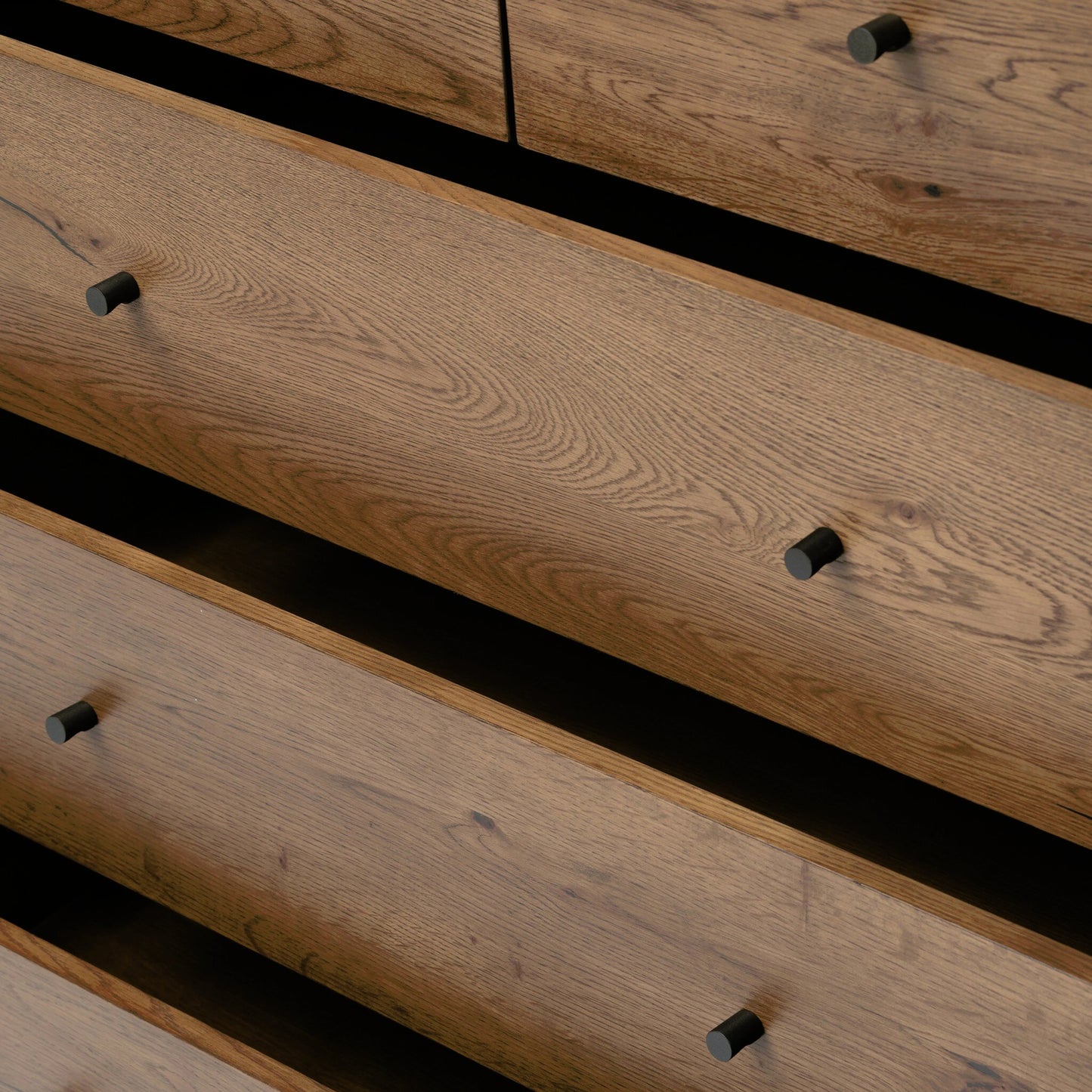 023 SI-1977260 | Closeup | Eaton 5 Drawer Dresser by Four Hands in dark gunmetal, amber oak resin. Made from thick oak veneer, iron in a rustic style.