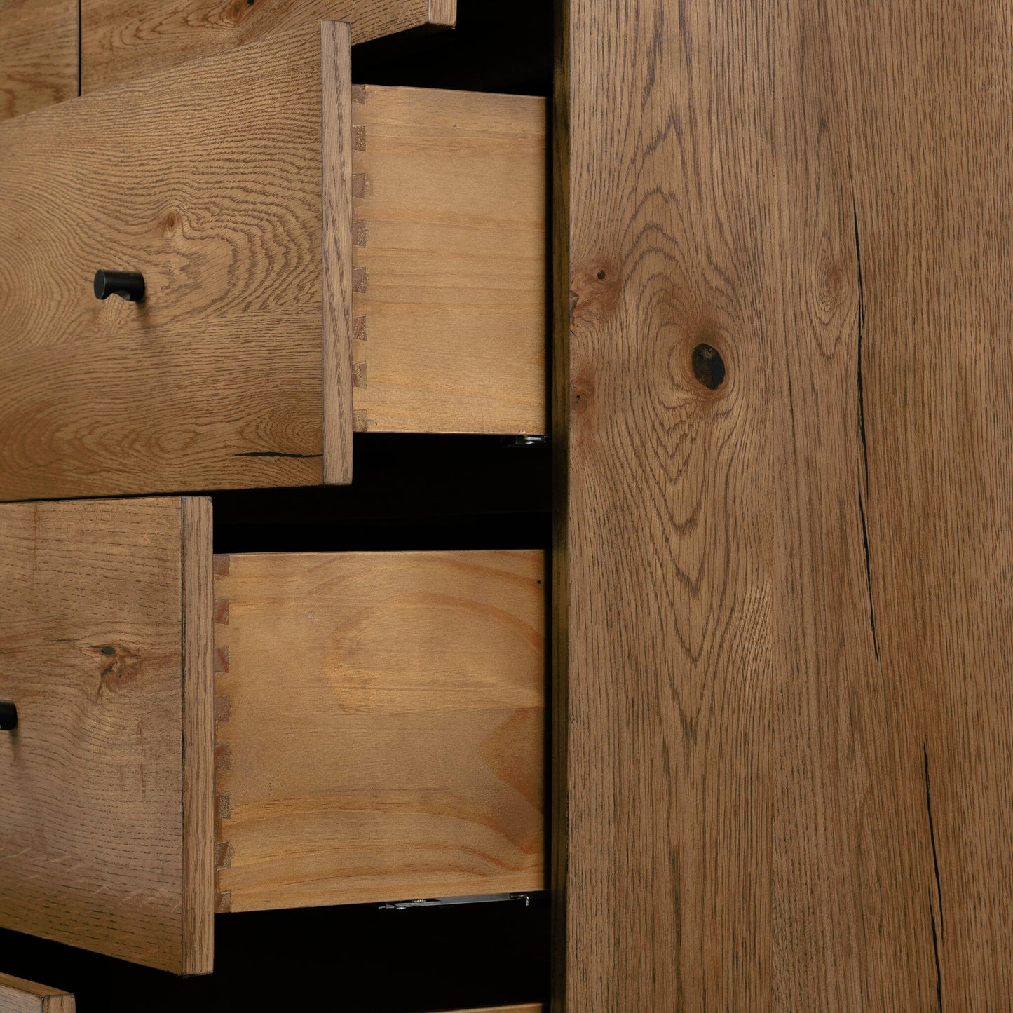 024 SI-1977260 | Closeup | Eaton 5 Drawer Dresser by Four Hands in dark gunmetal, amber oak resin. Made from thick oak veneer, iron in a rustic style.