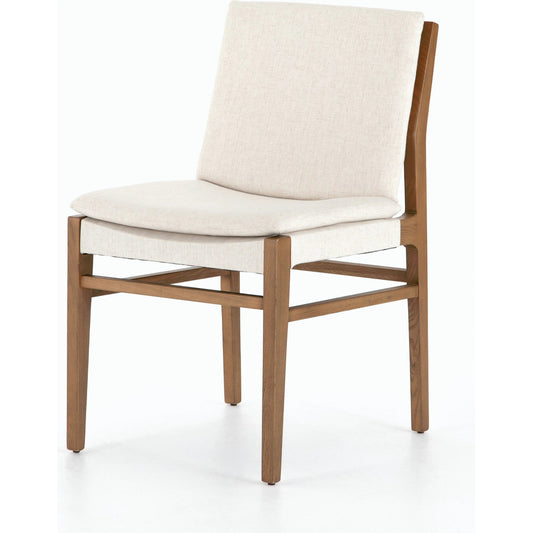 Aya Dining Chair by Four Hands in savile flax and natural brown. Made from 92% polyester, 8% flax, linen, solid nettlewood, 100% polyester in a coastal style.
