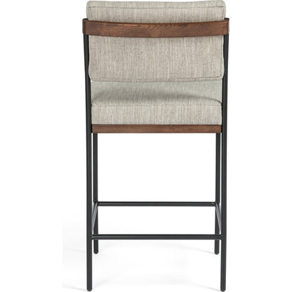 Benton Bar + Counter Stool by Four Hands in savile flannel and almond, midnight iron. Made from 92% polyester, 8% flax, linen, solid nettlewood, iron in a modern style.