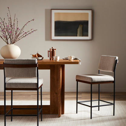 Benton Bar + Counter Stool by Four Hands in savile flannel and almond, midnight iron. Made from 92% polyester, 8% flax, linen, solid nettlewood, iron in a modern style.