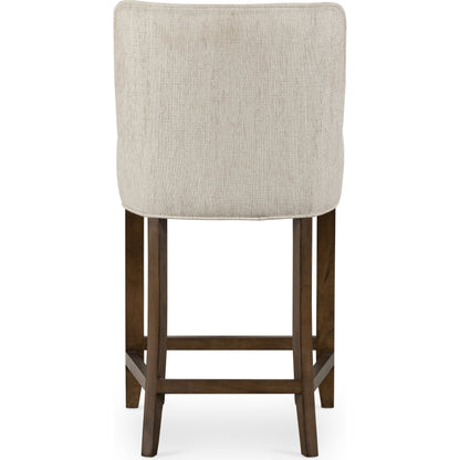 Aria Counter Stool by Four Hands in sienna chestnut. Made from top grain leather, solid nettlewood, 100% polyester in a modern style.
